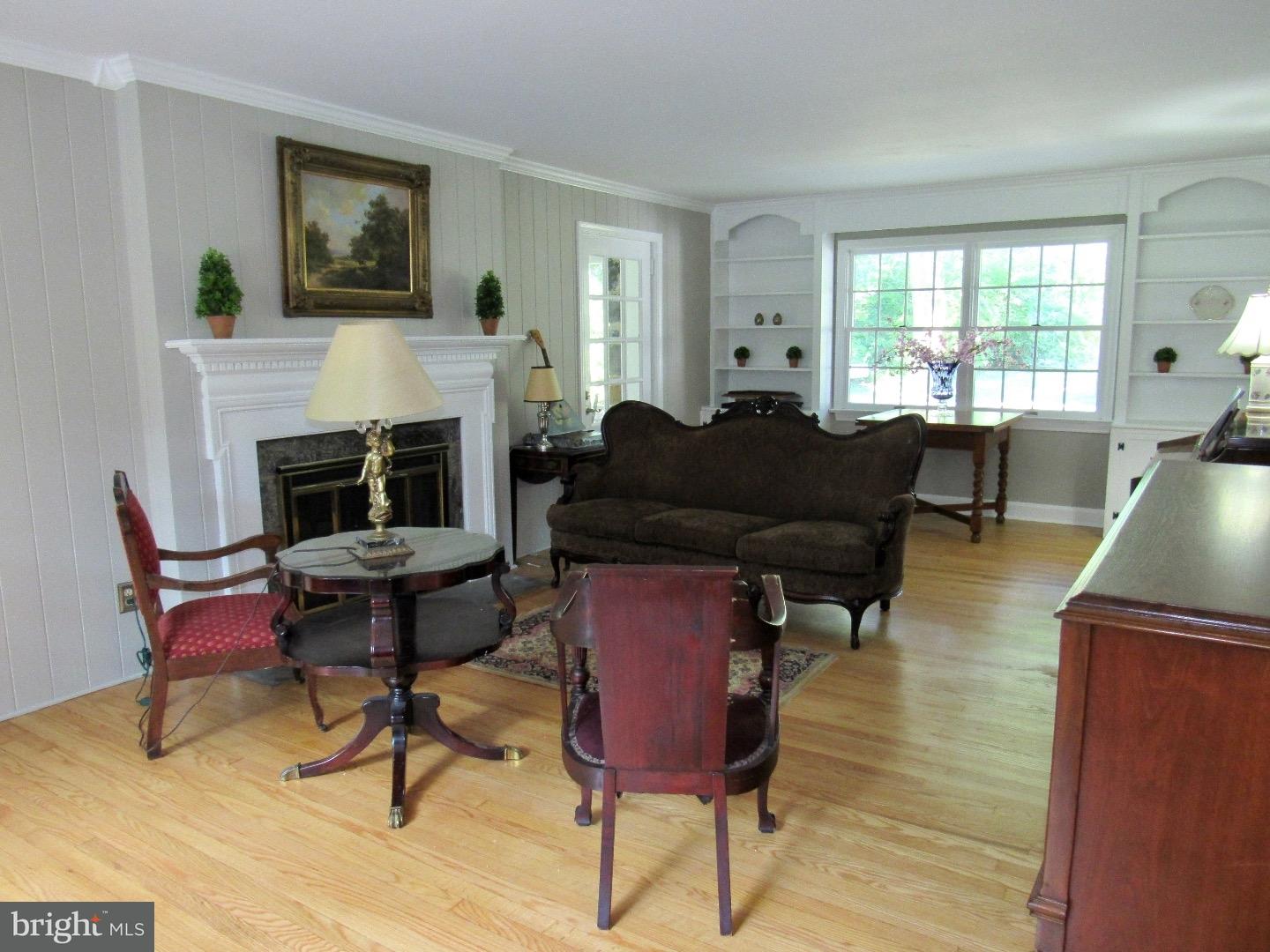 664 Parrish Road Swarthmore, PA 19081 - Photo 3 of 25 a living room with furniture and a fireplace
