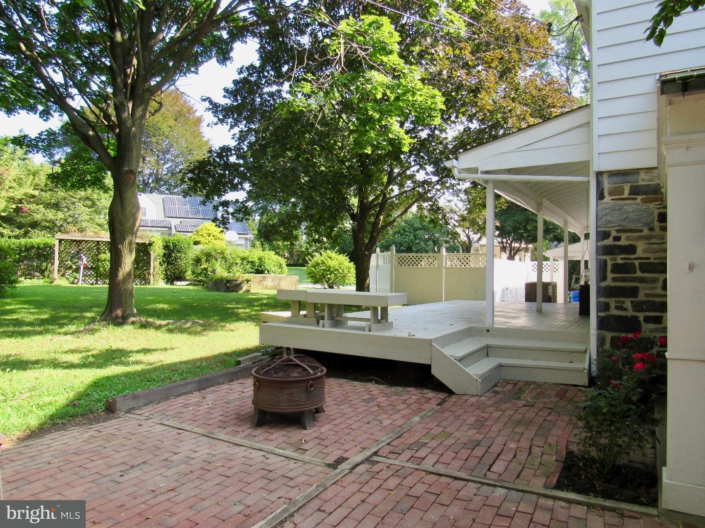 664 Parrish Road Swarthmore, PA 19081 - Photo 22 of 25 a view of a house with backyard sitting area and garden