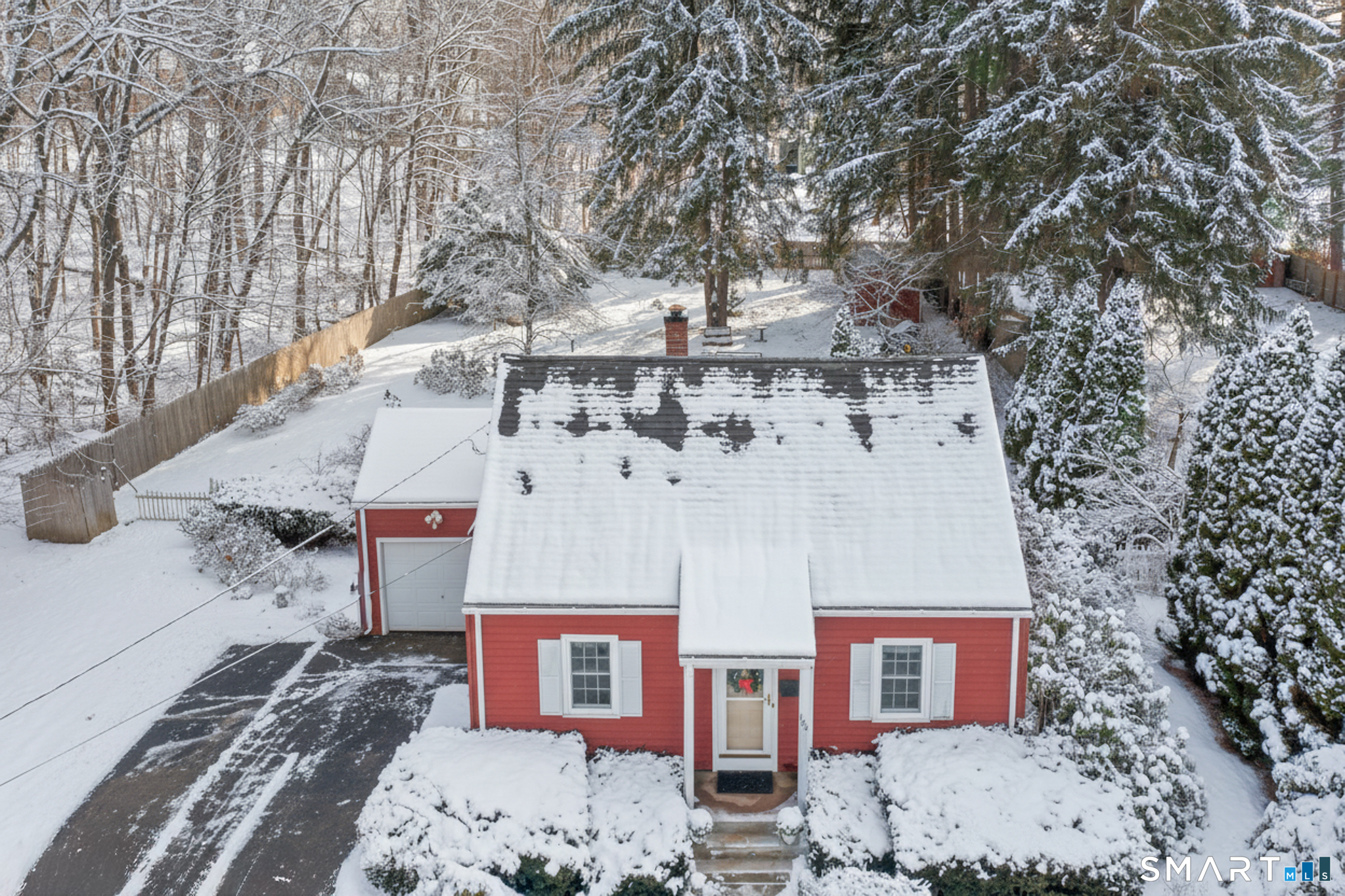 Notice the mature trees, fence and undeveloped land that borders this property.