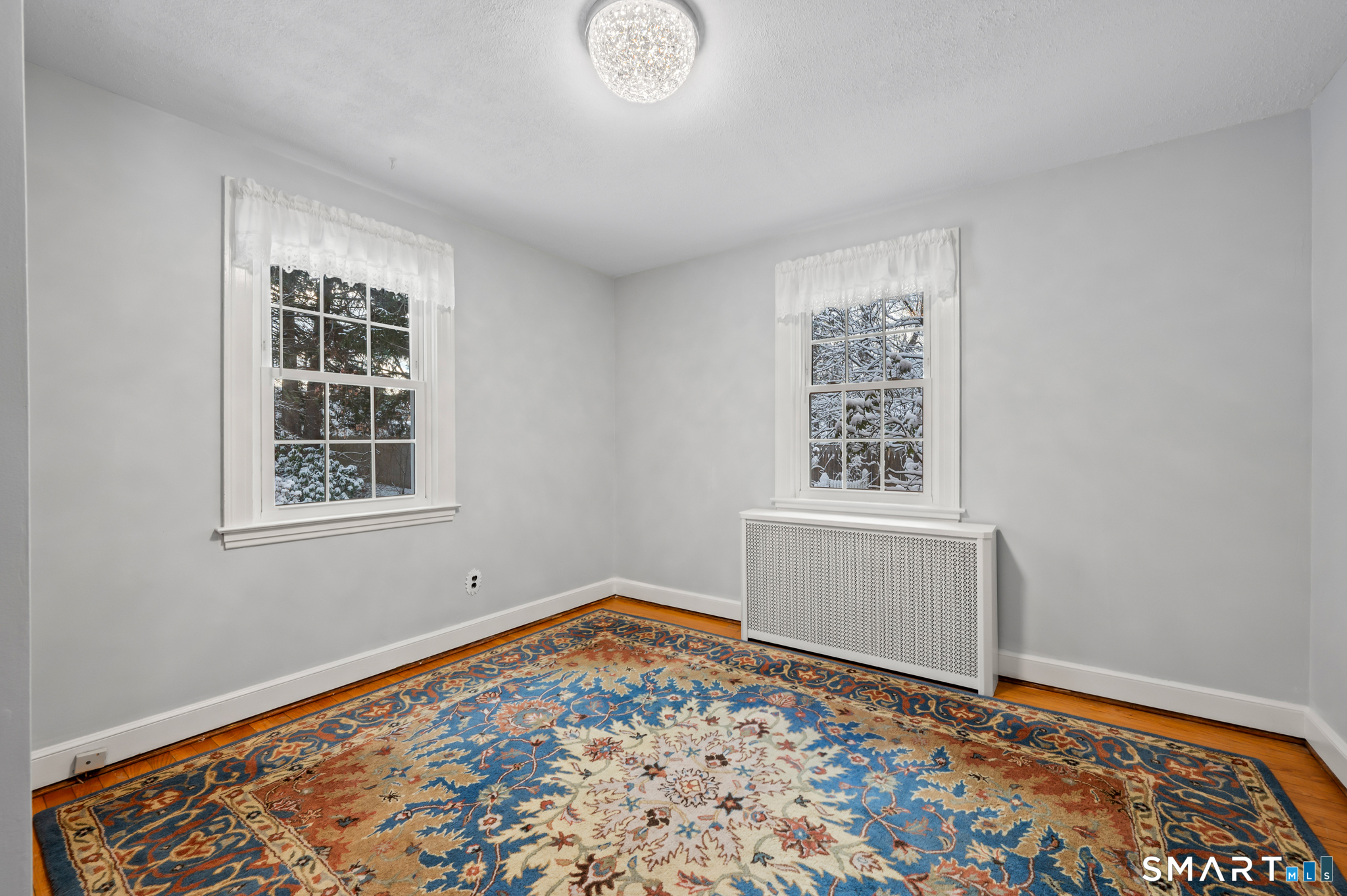 164 St John Street Manchester, CT 06040 - Photo 15 of 34 Primary bedroom on main level with hardwood flooring.
