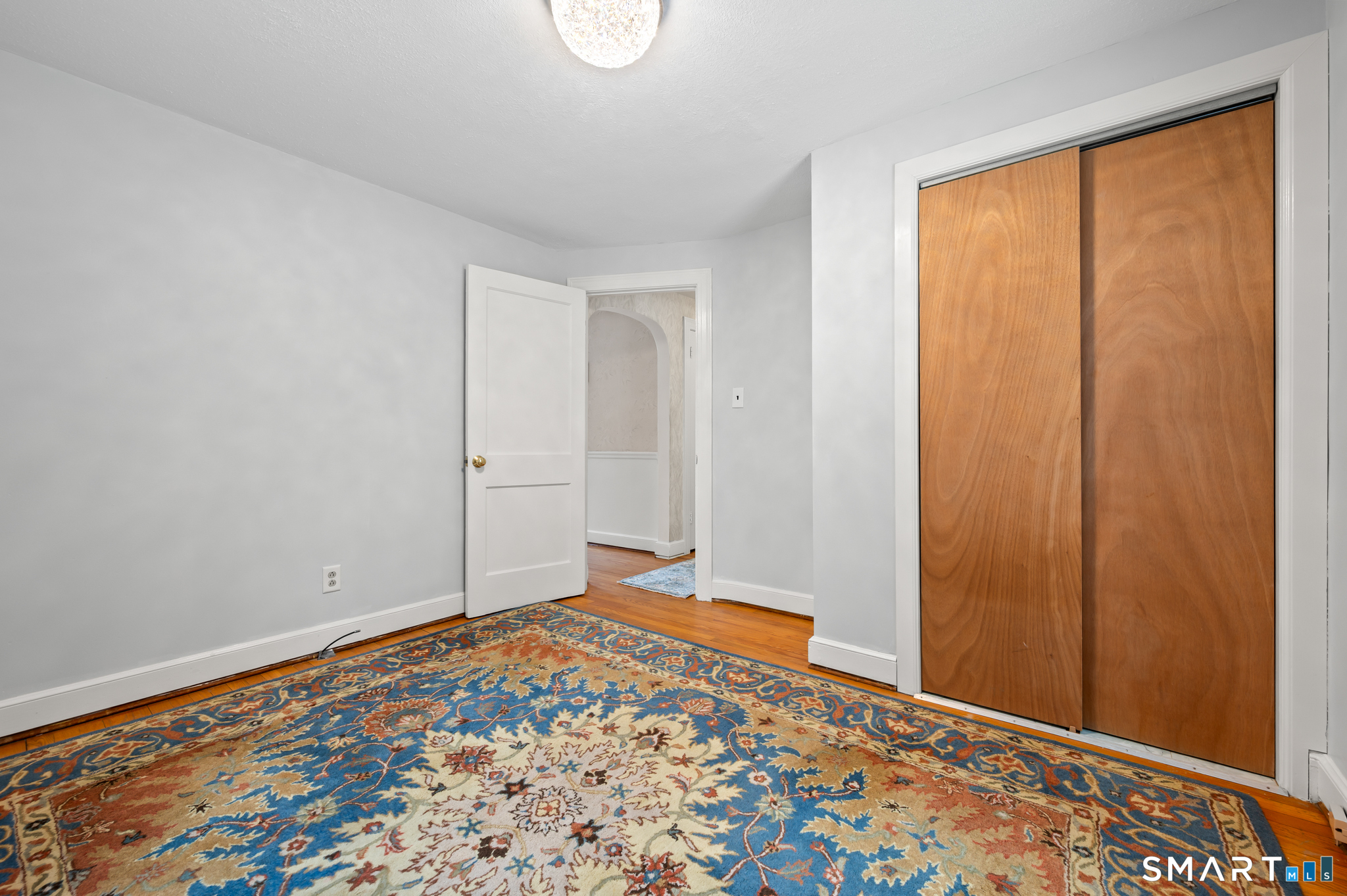 164 St John Street Manchester, CT 06040 - Photo 17 of 34 The primary bedroom is next to the full bath on the main level.