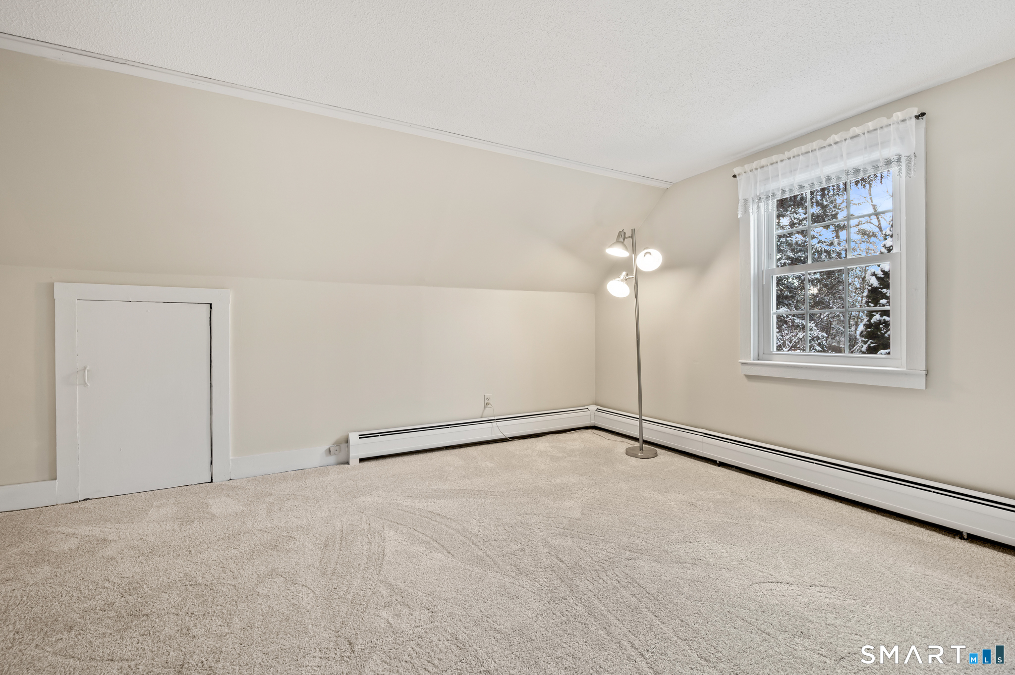 164 St John Street Manchester, CT 06040 - Photo 22 of 34 Notice the baseboard oil heat and additional storage in the knee wall closet.