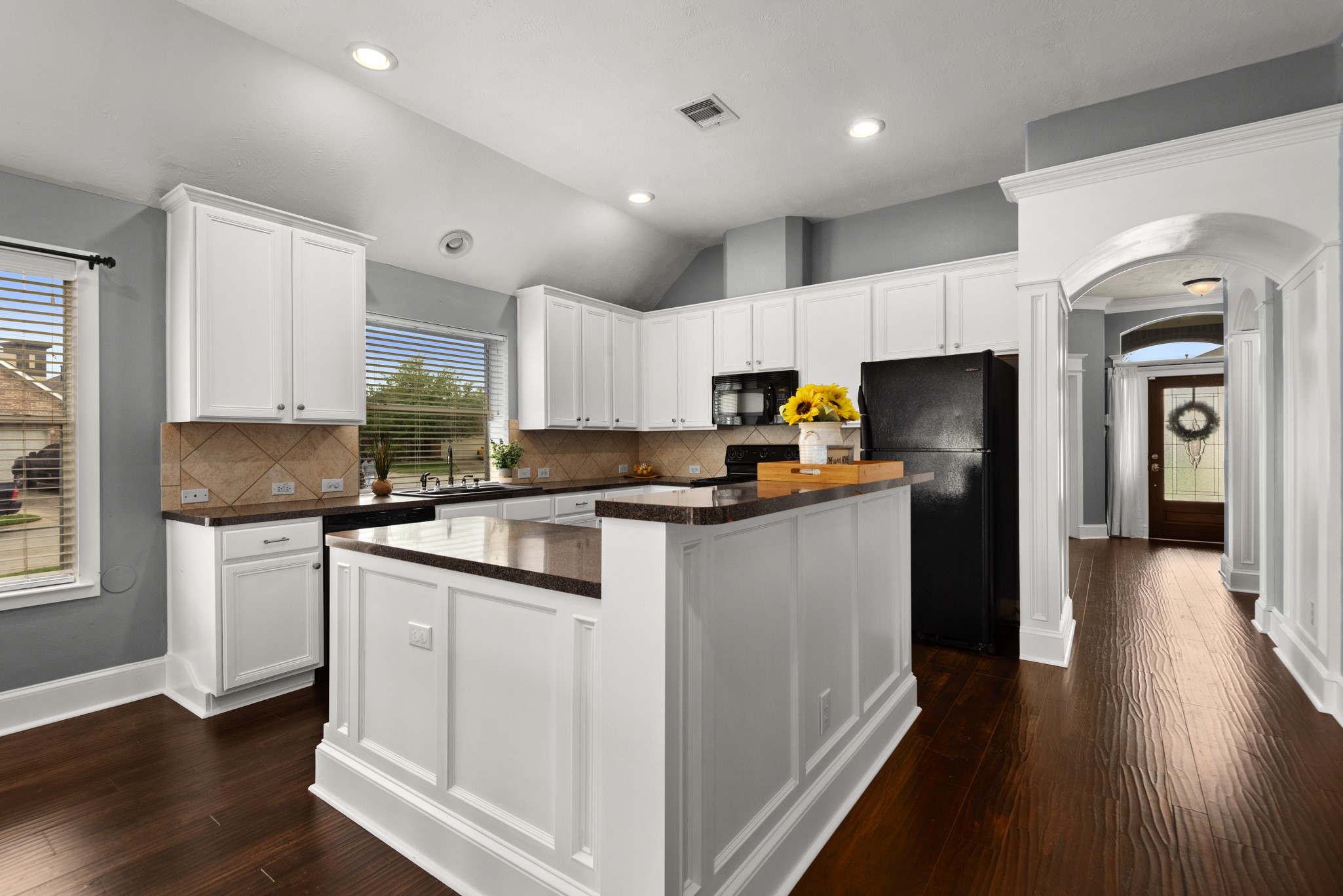 21710 Colter Stone Drive Spring, TX 77388 - Photo 10 of 35 Open island kitchen with custom woodwork! Refrigerator included.