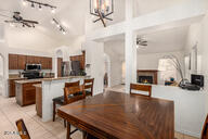 2646 North Robin Lane Mesa, AZ 85213 - Photo 12 of 45 a living room with furniture and a fireplace
