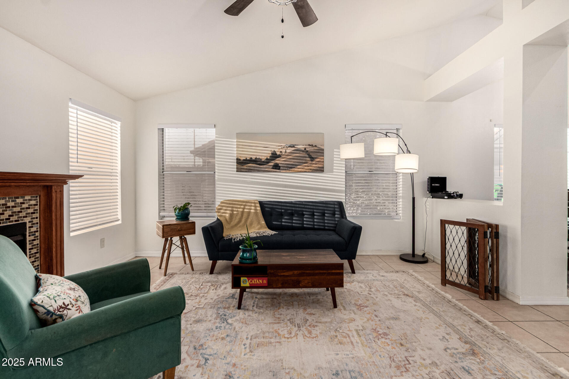 2646 North Robin Lane Mesa, AZ 85213 - Photo 17 of 45 a living room with furniture and a fireplace