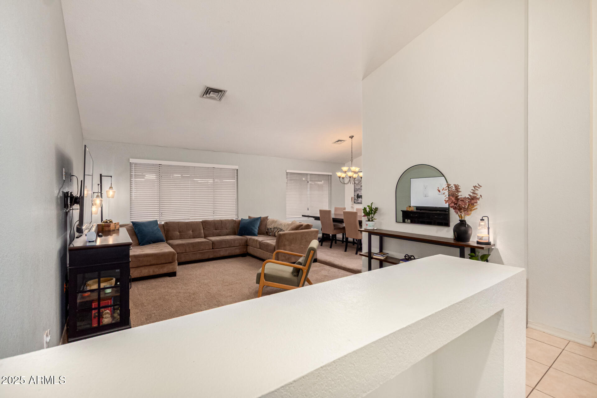 2646 North Robin Lane Mesa, AZ 85213 - Photo 21 of 45 a living room with furniture and a mirror