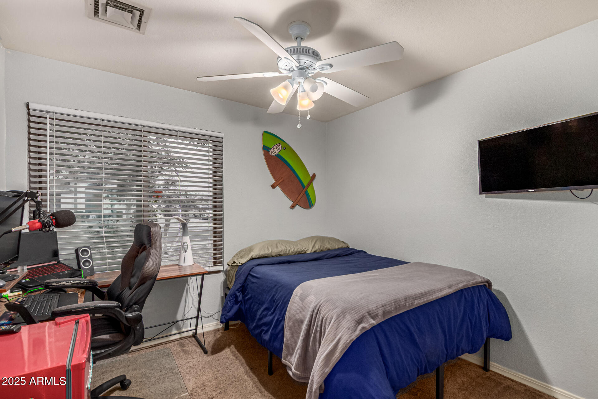 2646 North Robin Lane Mesa, AZ 85213 - Photo 26 of 45 a bedroom with a bed and a flat screen tv