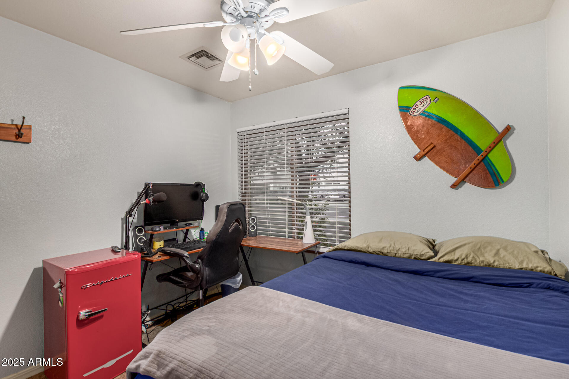 2646 North Robin Lane Mesa, AZ 85213 - Photo 27 of 45 a bedroom with a bed and wooden floor