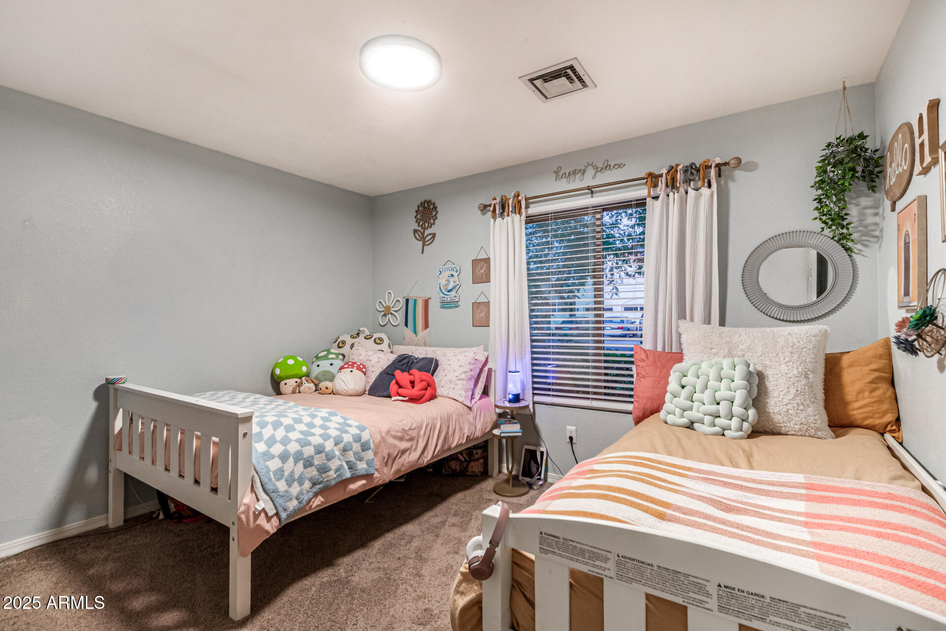 2646 North Robin Lane Mesa, AZ 85213 - Photo 28 of 45 a bedroom with two beds and window