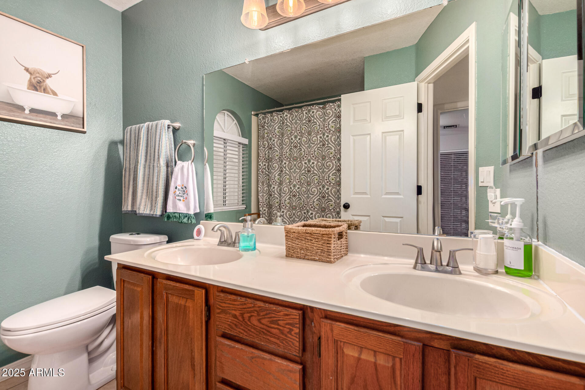 2646 North Robin Lane Mesa, AZ 85213 - Photo 32 of 45 a bathroom with a sink and a toilet