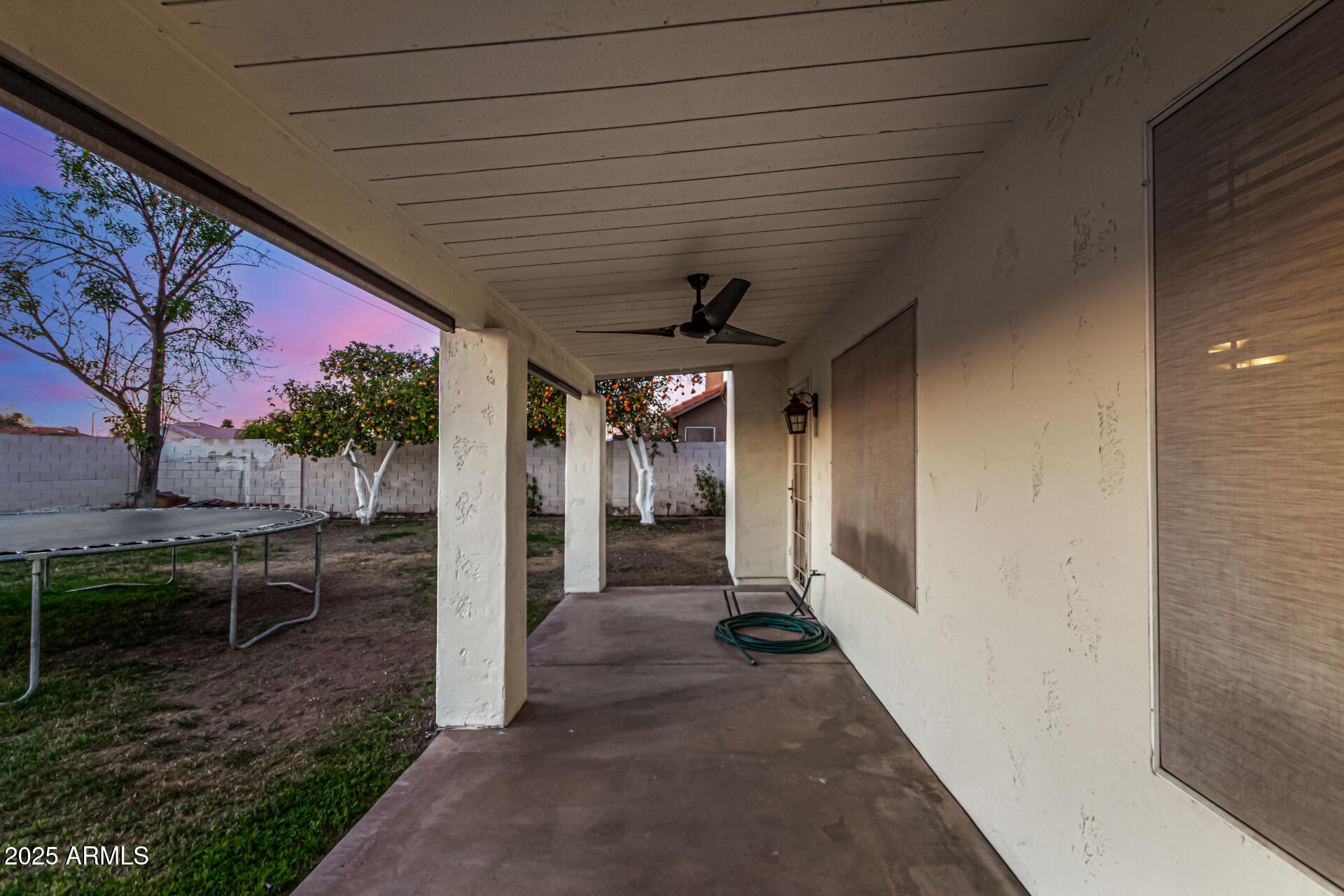 2646 North Robin Lane Mesa, AZ 85213 - Photo 35 of 45 a view of a porch with furniture and a yard