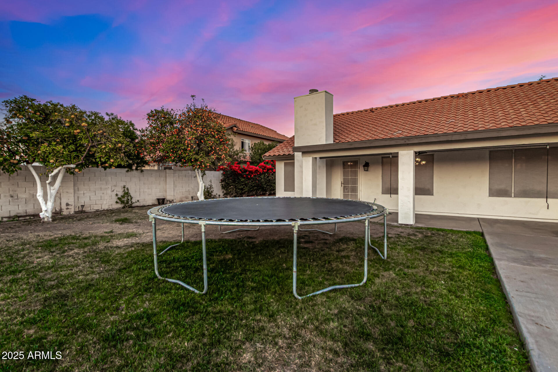 2646 North Robin Lane Mesa, AZ 85213 - Photo 39 of 45 a backyard of a house with table and chairs