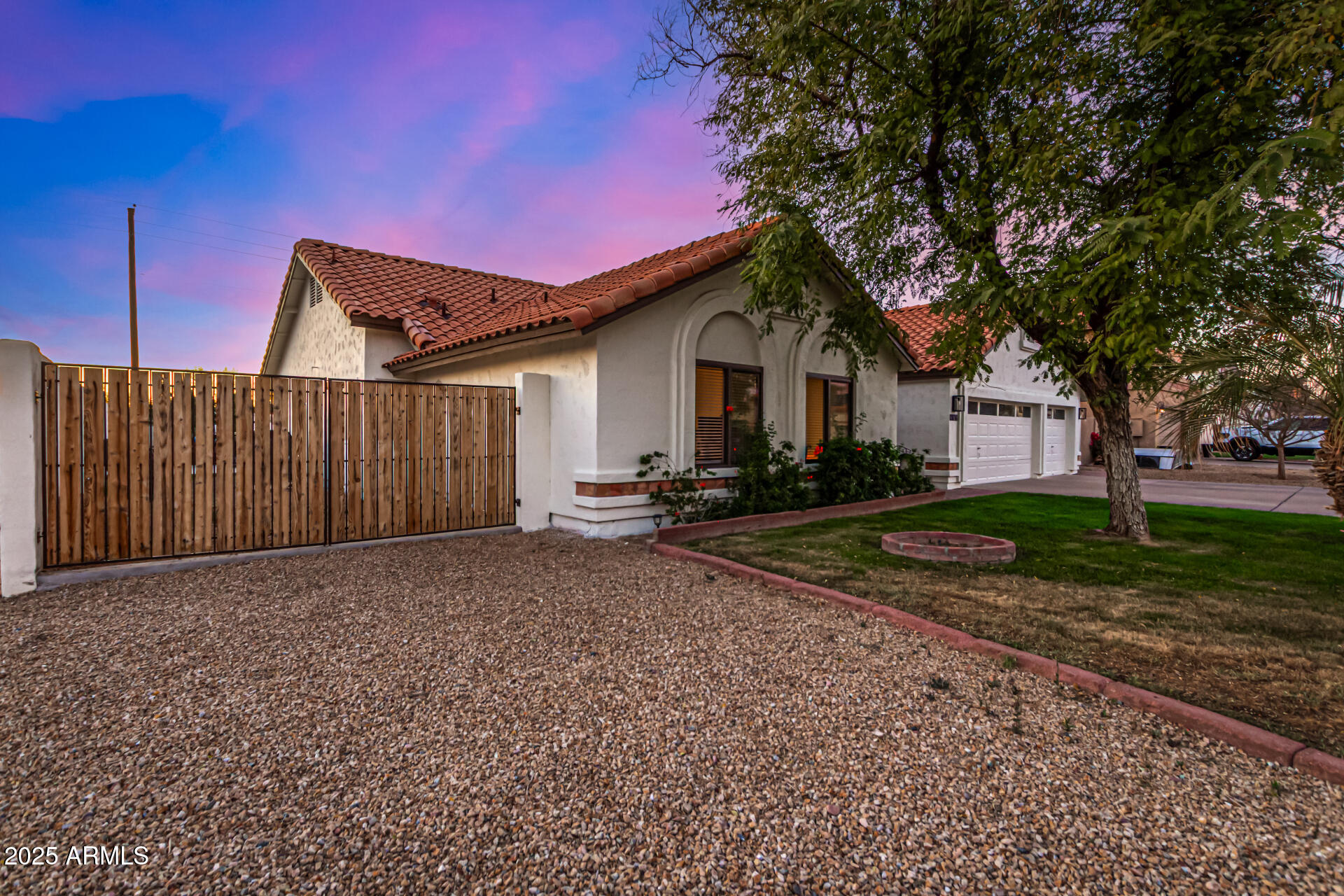 2646 North Robin Lane Mesa, AZ 85213 - Photo 4 of 45 a front view of a house with a yard