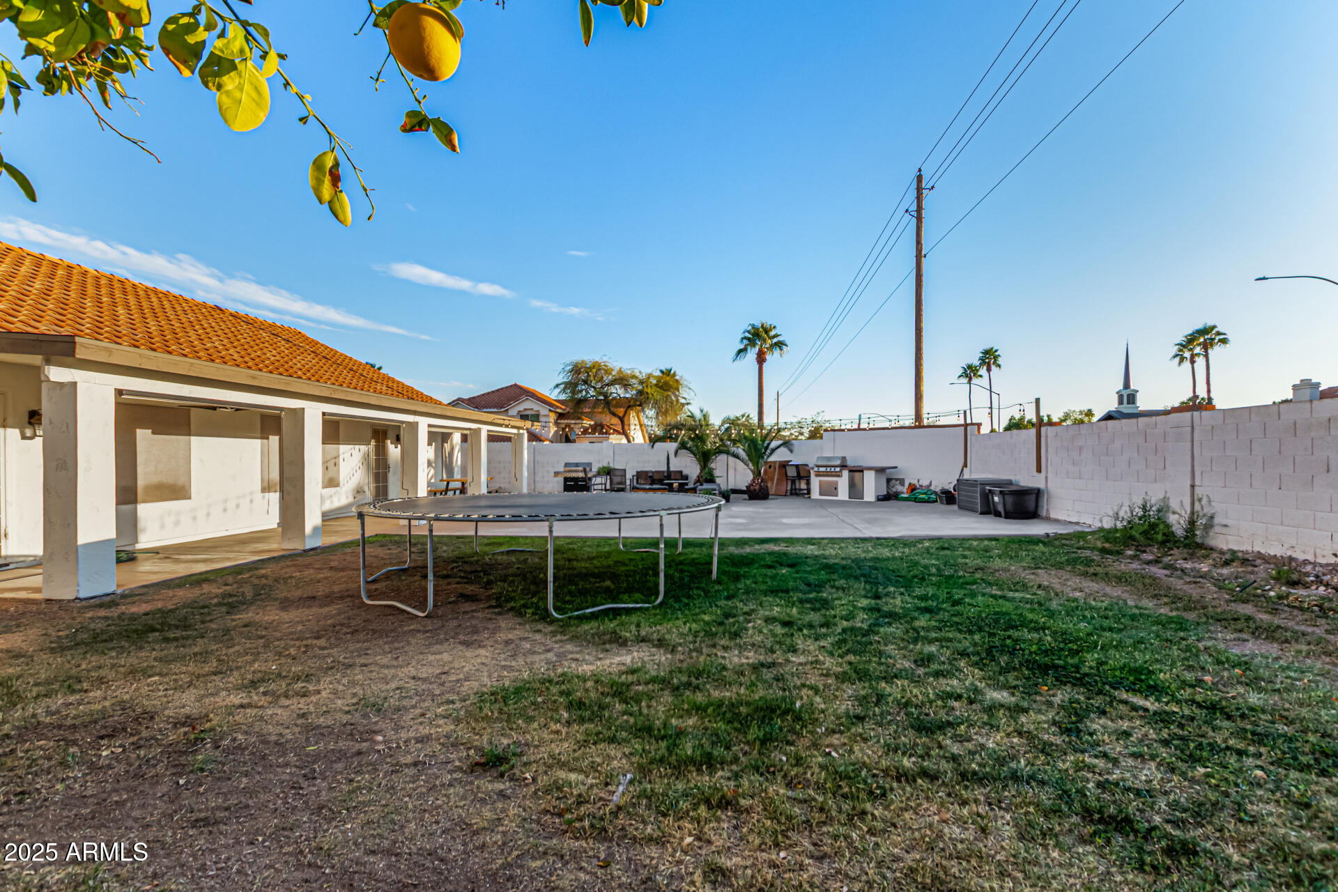 2646 North Robin Lane Mesa, AZ 85213 - Photo 45 of 45 a view of a house with a backyard and a table