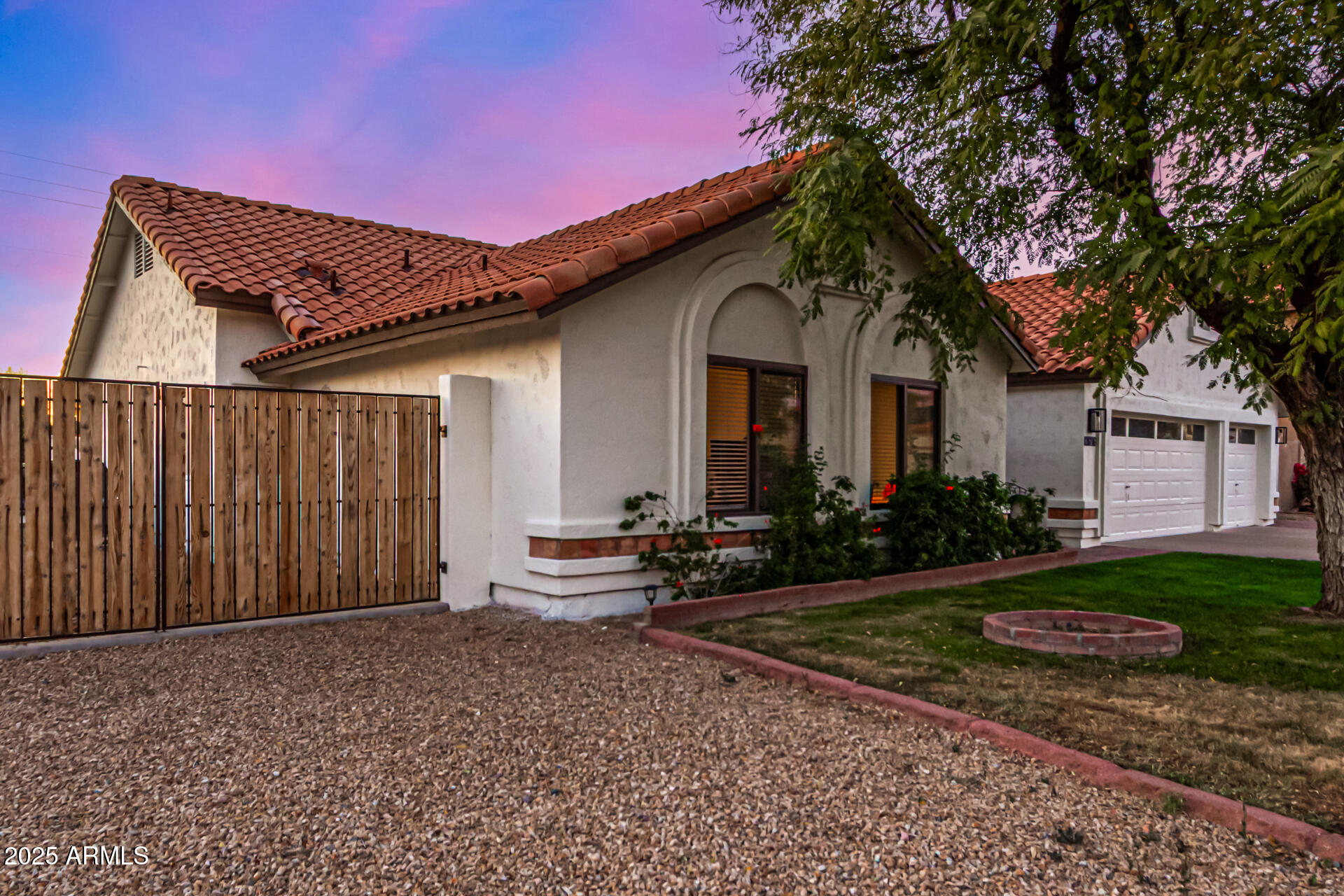2646 North Robin Lane Mesa, AZ 85213 - Photo 5 of 45 a front view of a house with garden