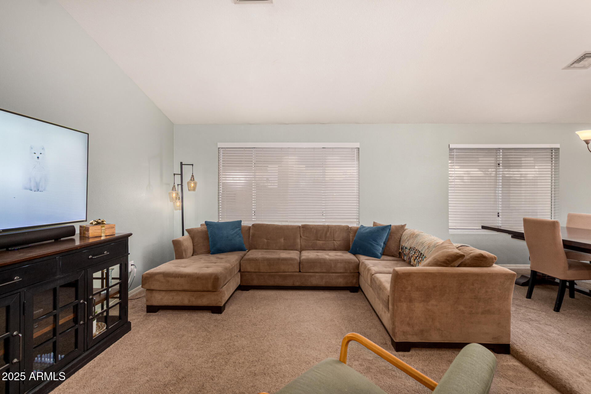 2646 North Robin Lane Mesa, AZ 85213 - Photo 8 of 45 a living room with furniture and a flat screen tv