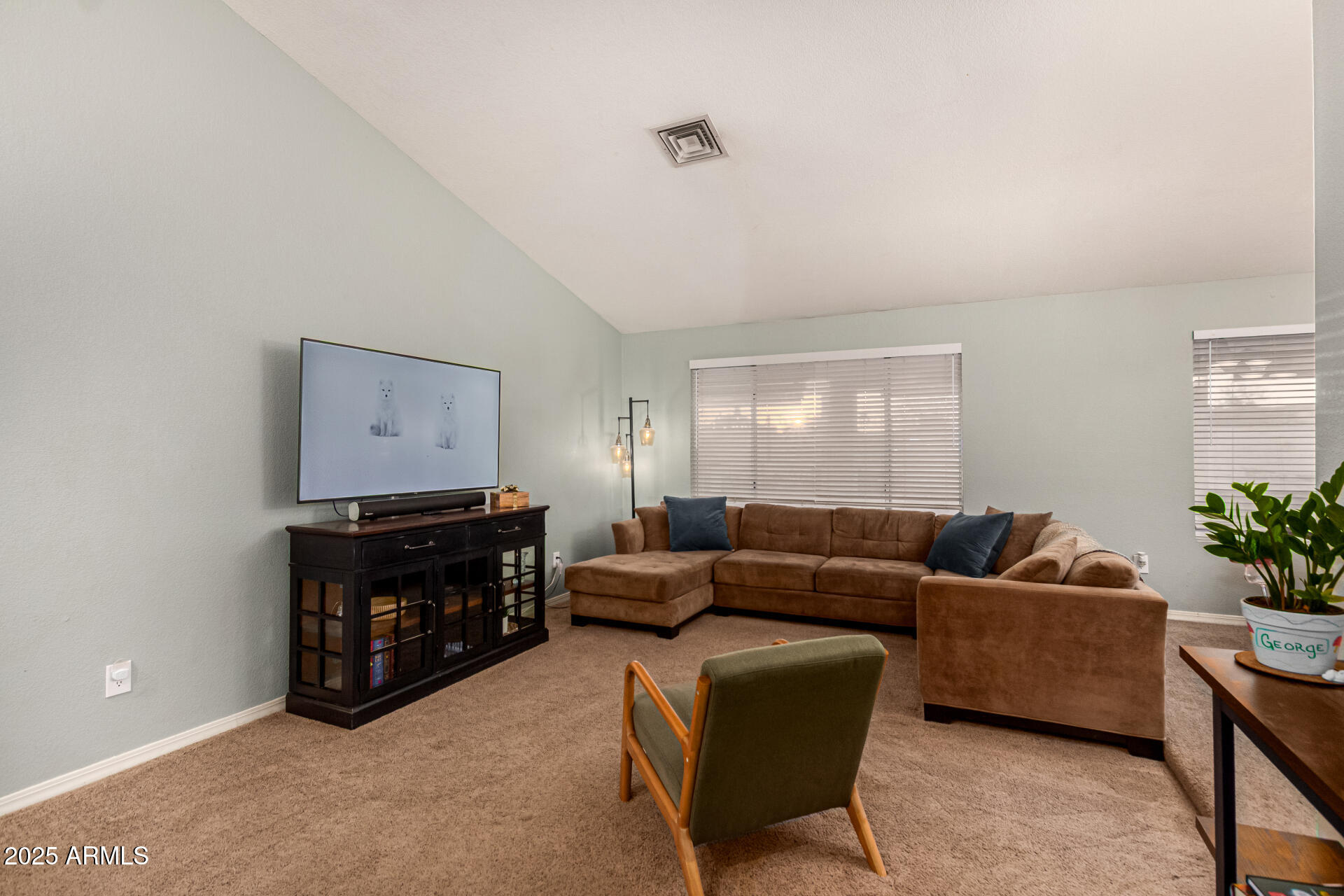 2646 North Robin Lane Mesa, AZ 85213 - Photo 9 of 45 a living room with furniture and a flat screen tv