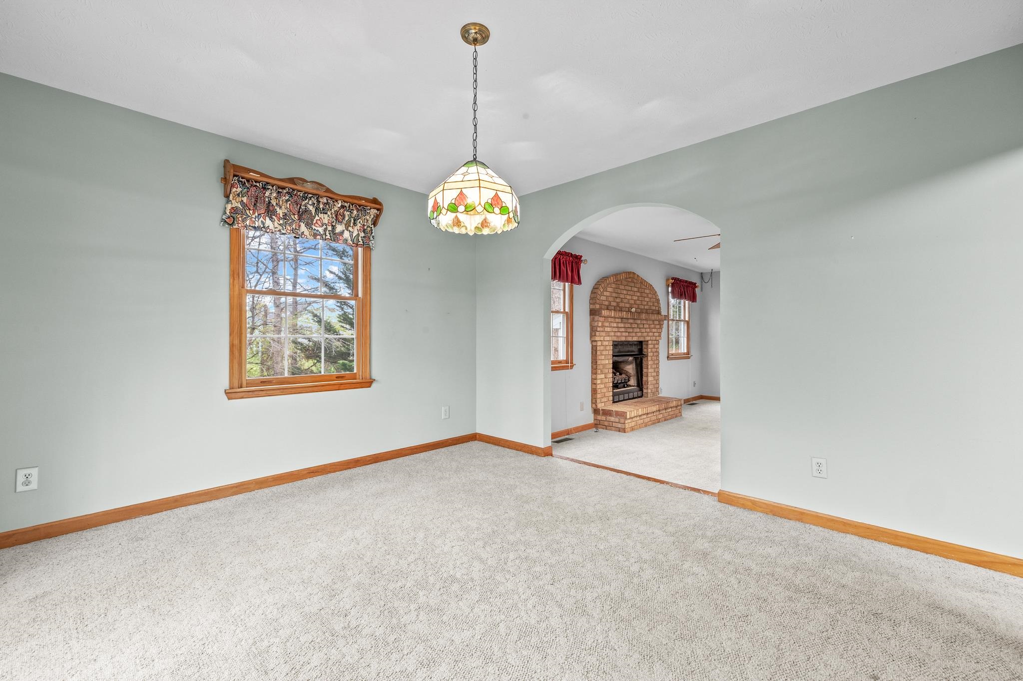 333 Cranberry Drive Stuarts Draft, VA 24477 - Photo 11 of 48 a view of a room with window chandelier