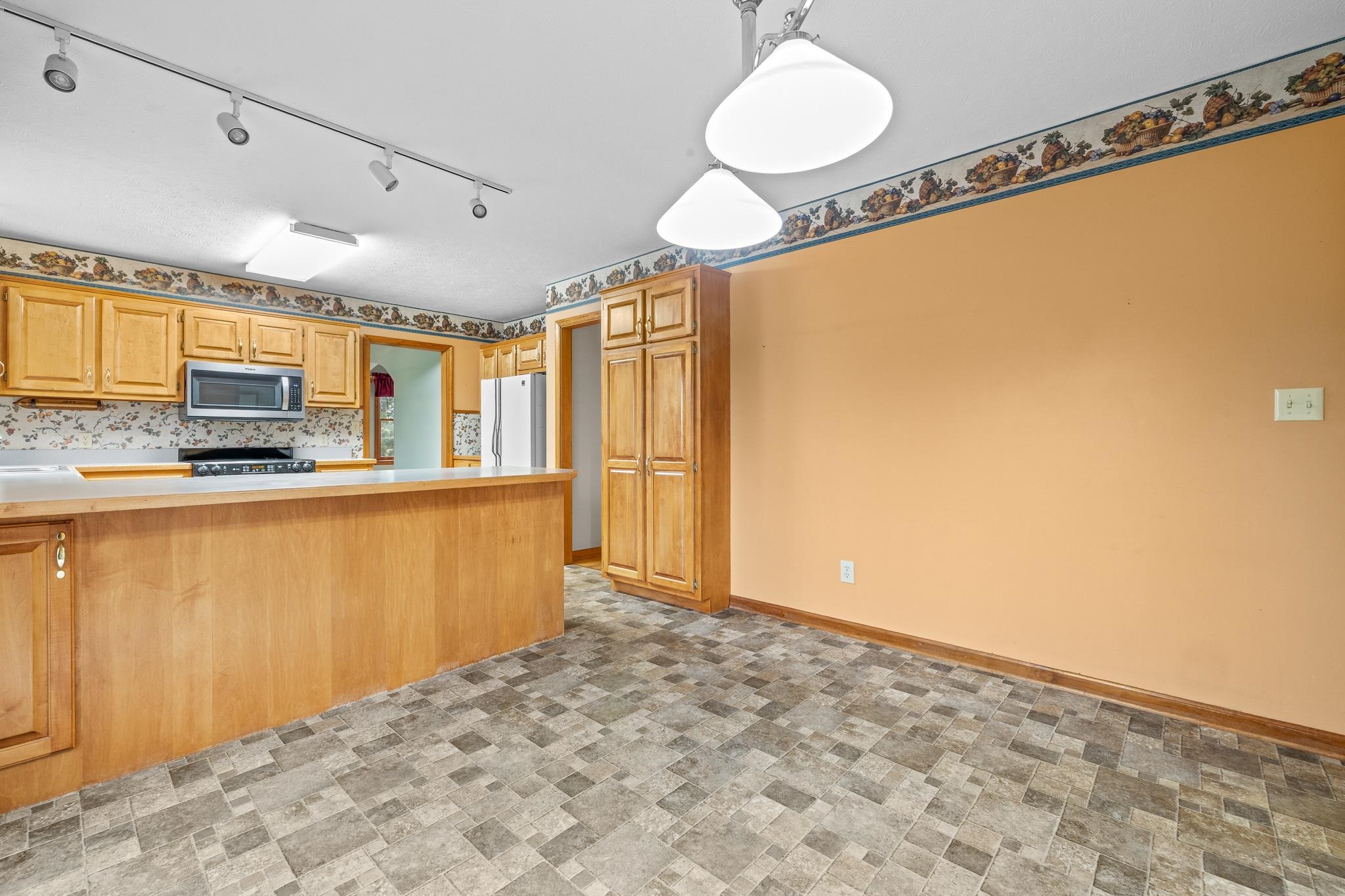 333 Cranberry Drive Stuarts Draft, VA 24477 - Photo 20 of 48 a kitchen with stainless steel appliances a refrigerator and microwave