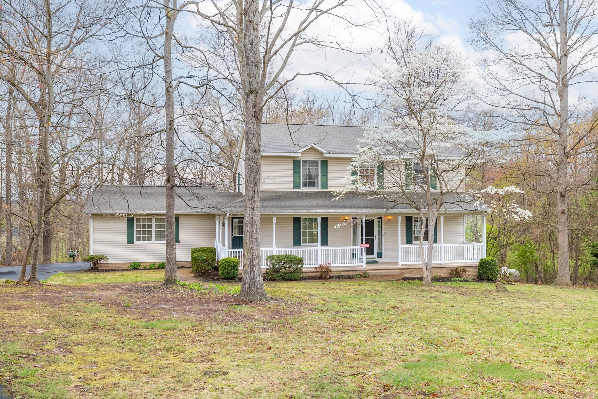 333 Cranberry Drive Stuarts Draft, VA 24477 - Photo 2 of 48 a front view of a house with large garden