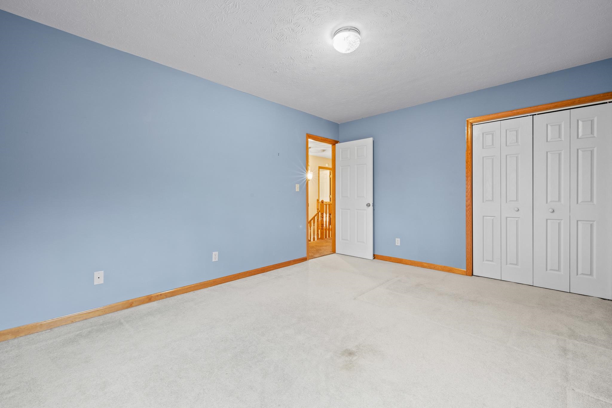 333 Cranberry Drive Stuarts Draft, VA 24477 - Photo 37 of 48 an empty room with a window and a ceiling fan