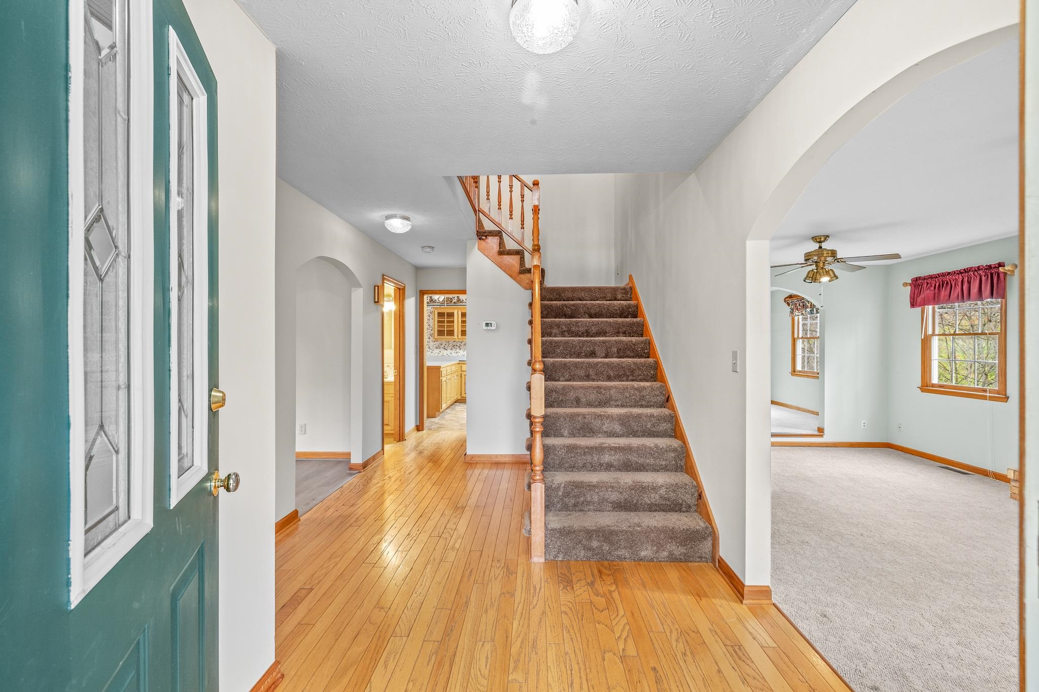 333 Cranberry Drive Stuarts Draft, VA 24477 - Photo 4 of 48 a view of a hallway with wooden floor and staircase