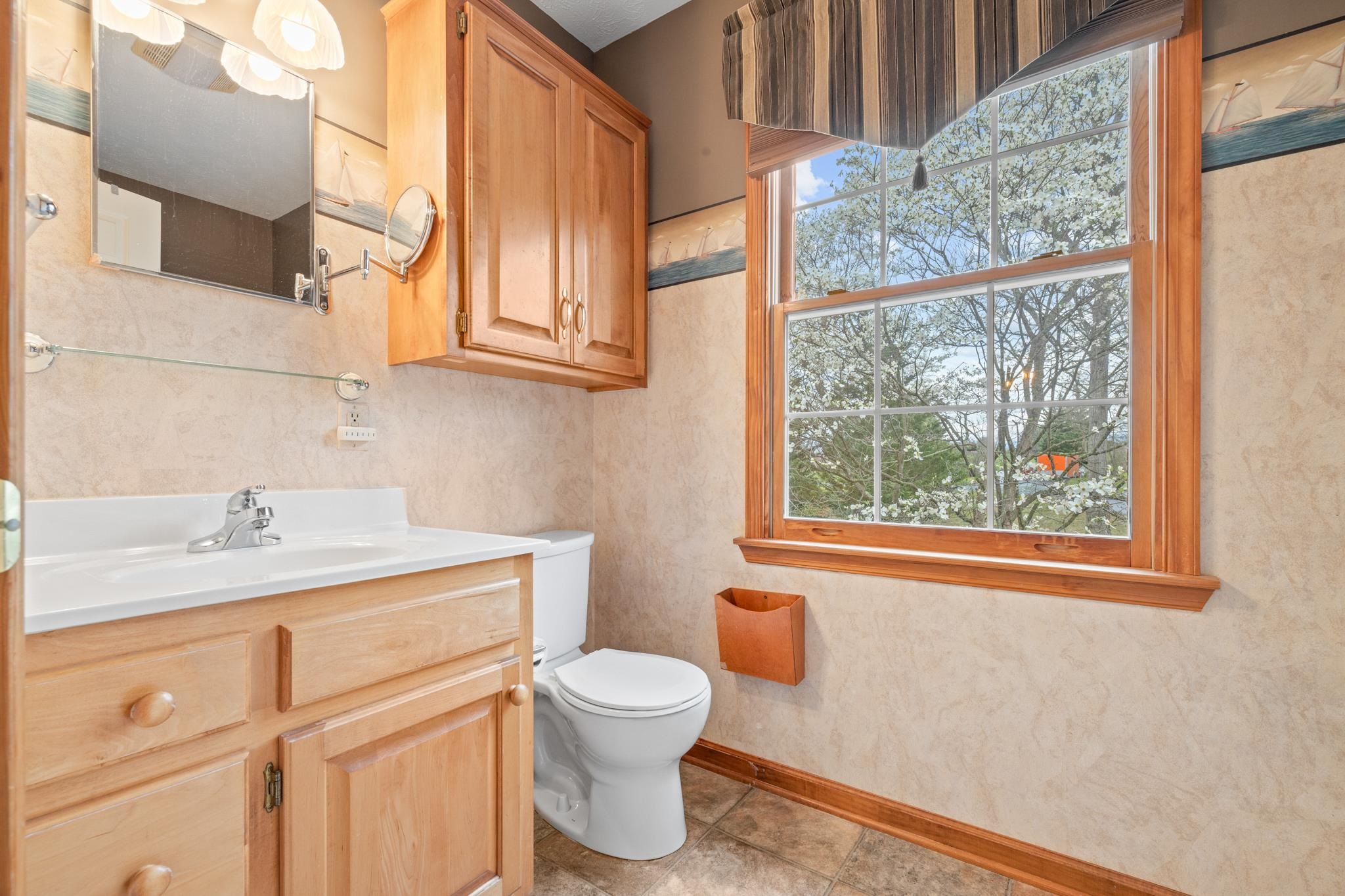 333 Cranberry Drive Stuarts Draft, VA 24477 - Photo 41 of 48 a bathroom with a toilet a sink and a window
