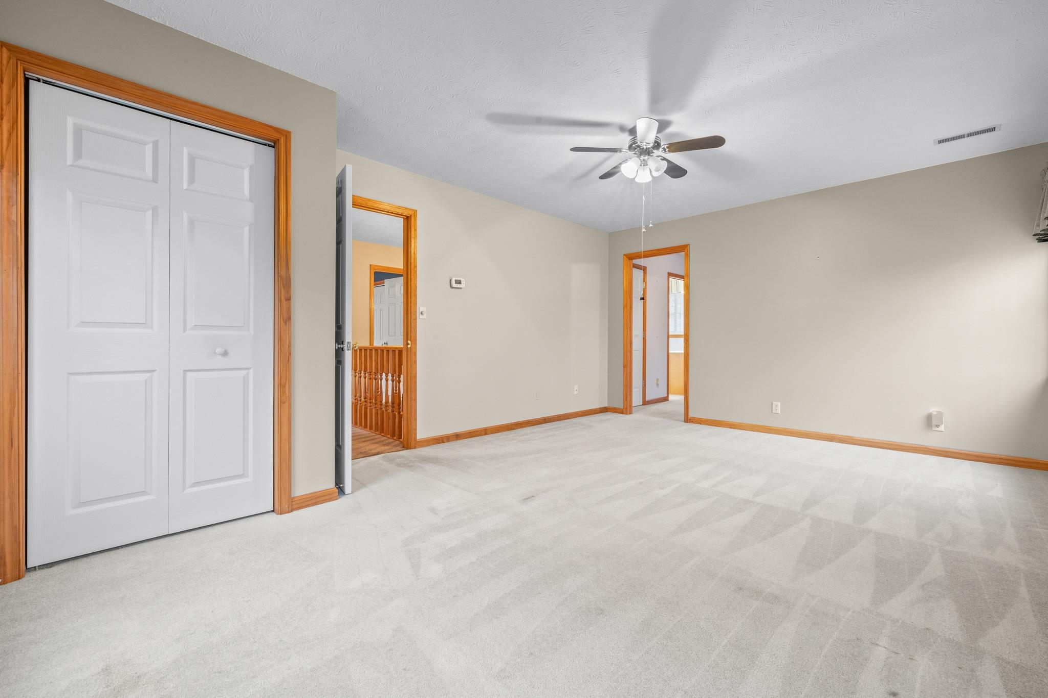 333 Cranberry Drive Stuarts Draft, VA 24477 - Photo 44 of 48 a view of an empty room with a ceiling fan