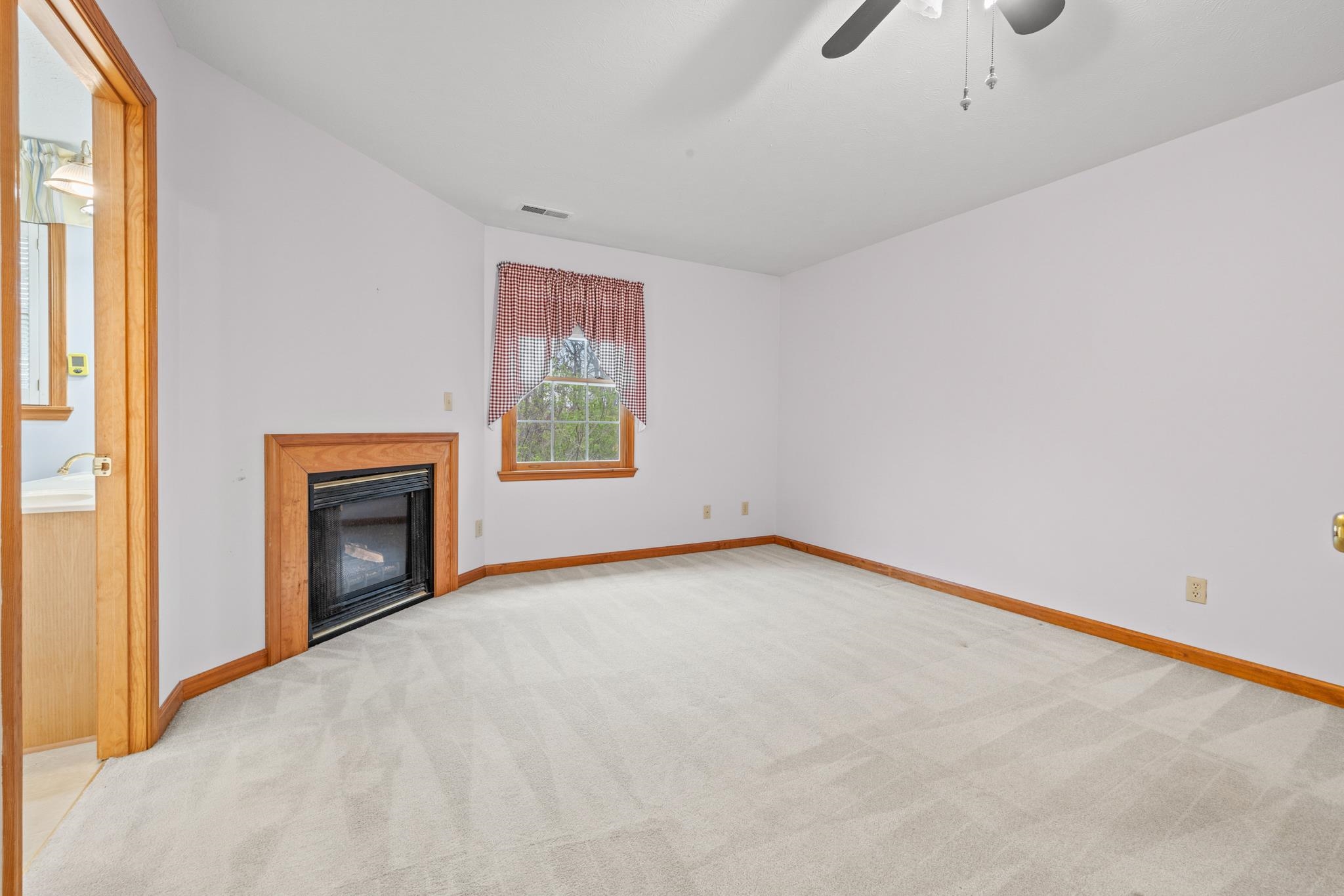 333 Cranberry Drive Stuarts Draft, VA 24477 - Photo 46 of 48 a view of an empty room with a window and fireplace