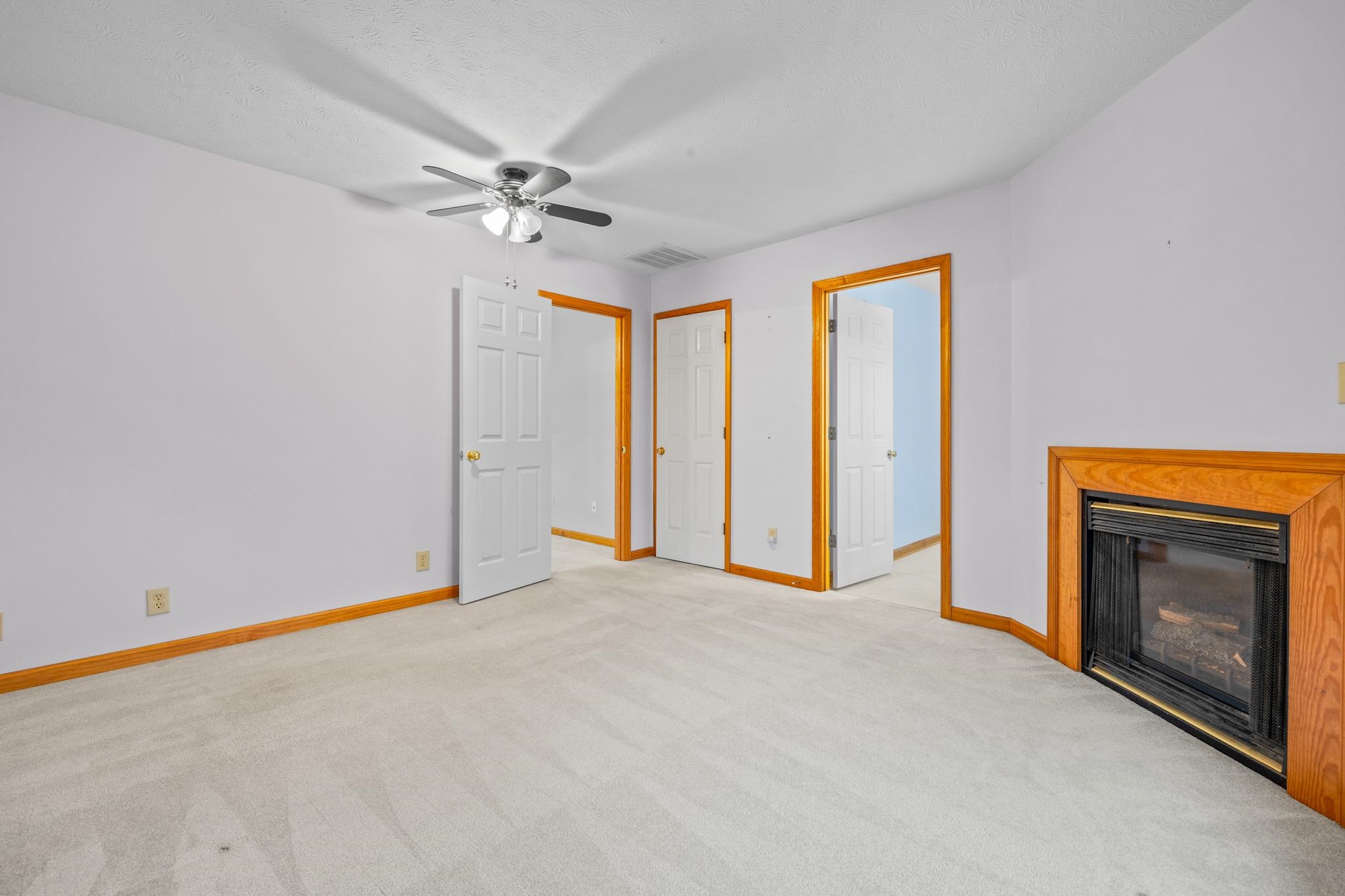 333 Cranberry Drive Stuarts Draft, VA 24477 - Photo 47 of 48 a view of empty room with fan and a fireplace