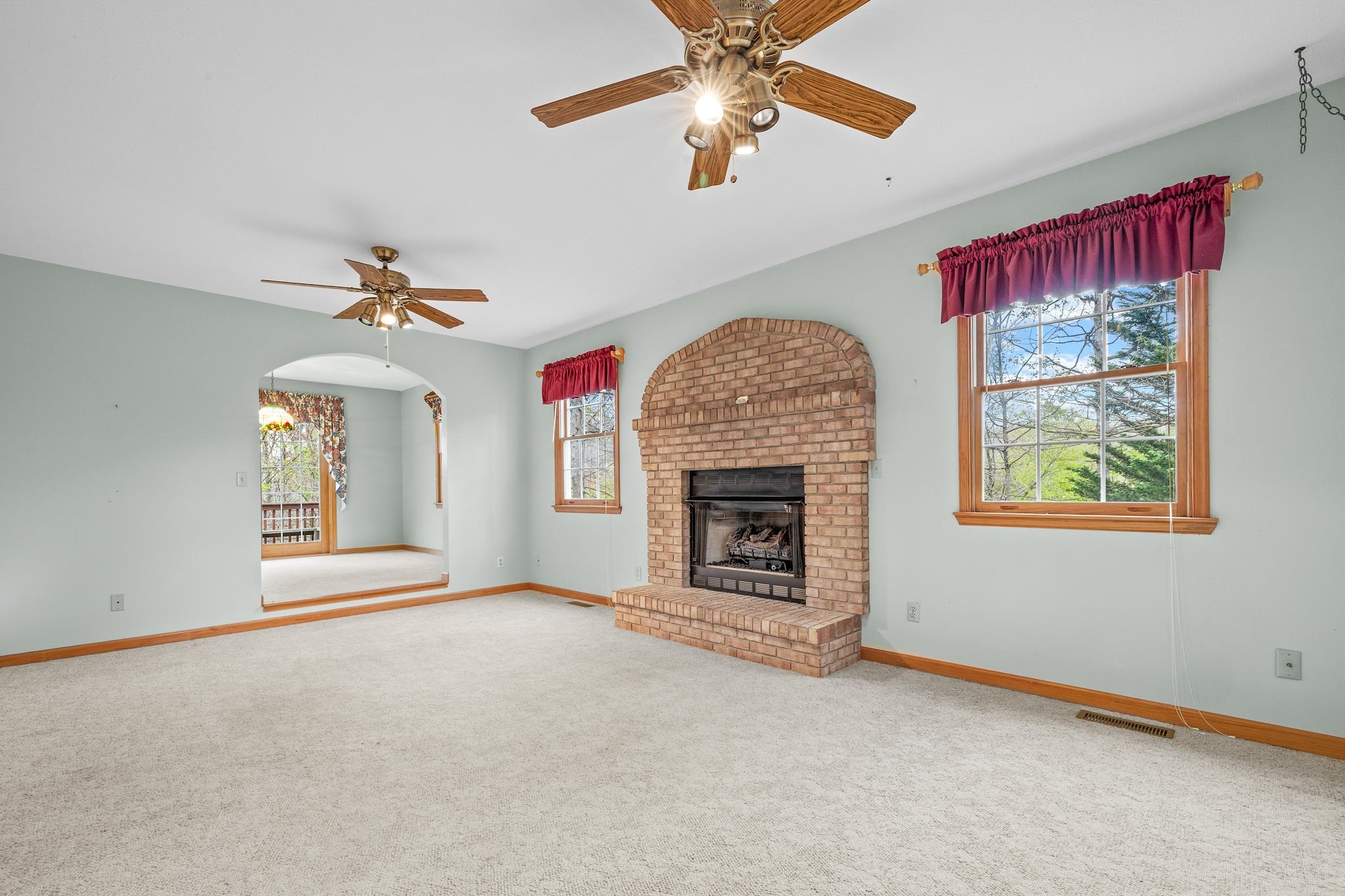 333 Cranberry Drive Stuarts Draft, VA 24477 - Photo 6 of 48 an empty room with windows and fireplace