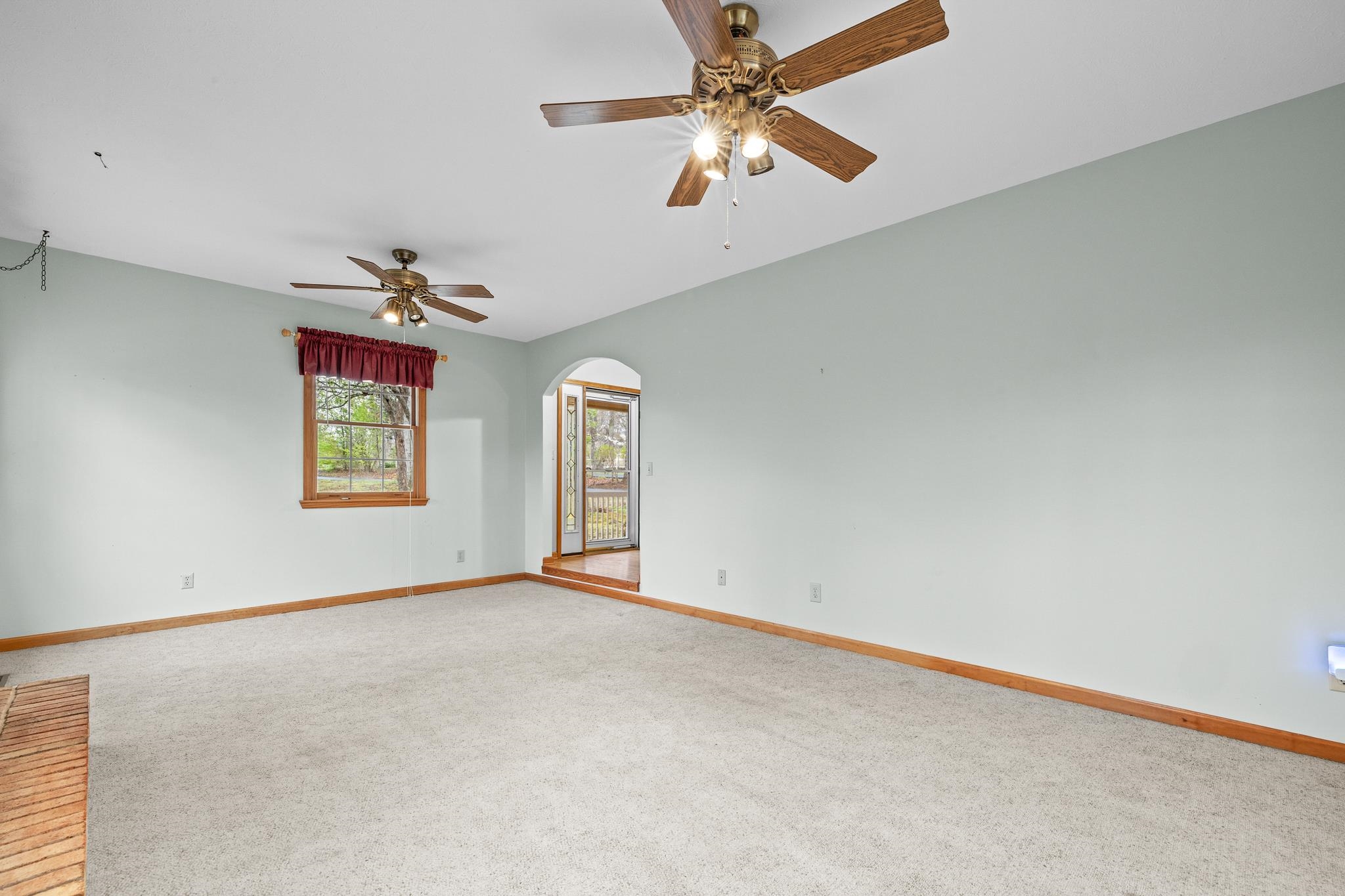 333 Cranberry Drive Stuarts Draft, VA 24477 - Photo 9 of 48 an empty room with windows and fan