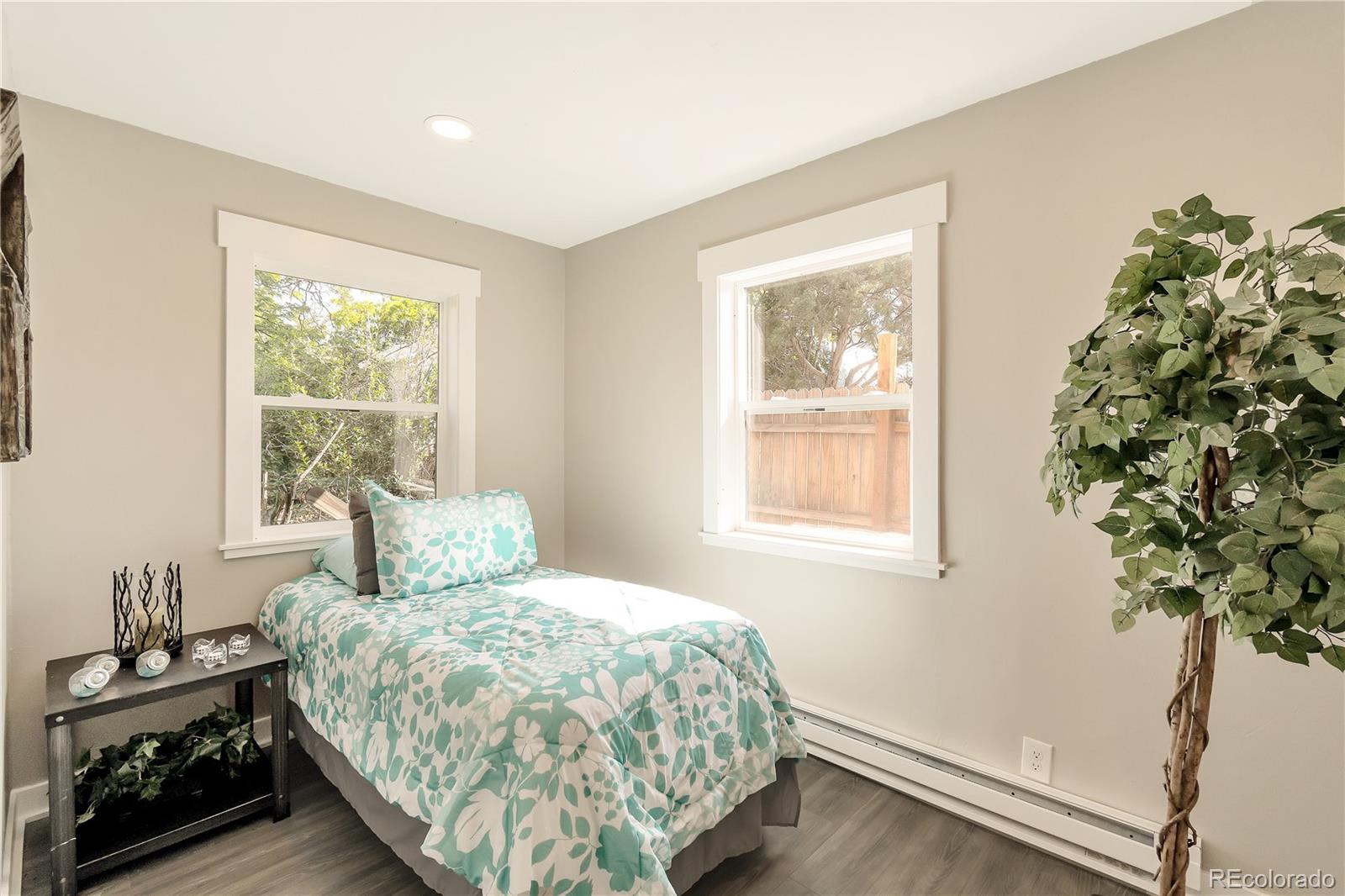 2868 Benton Street Wheat Ridge, CO 80214 - Photo 15 of 22 a bedroom with a bed and a window