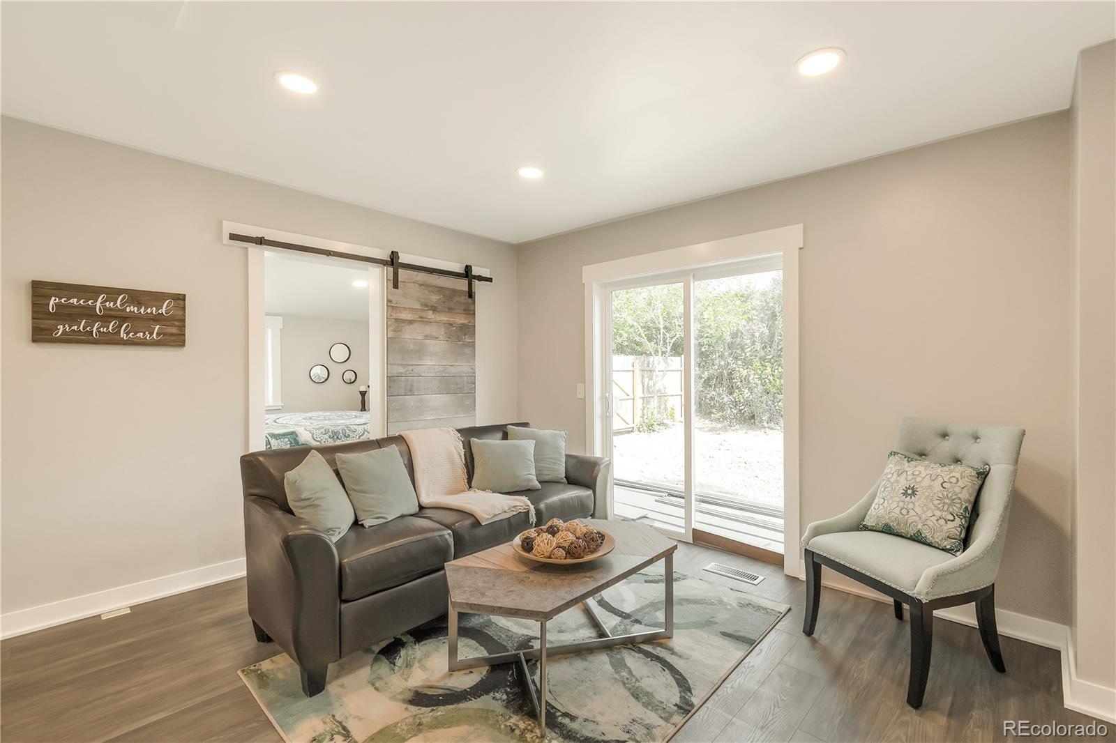 2868 Benton Street Wheat Ridge, CO 80214 - Photo 2 of 22 a living room with furniture and a window