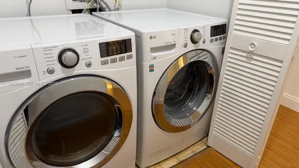 a utility room with dryer and washer