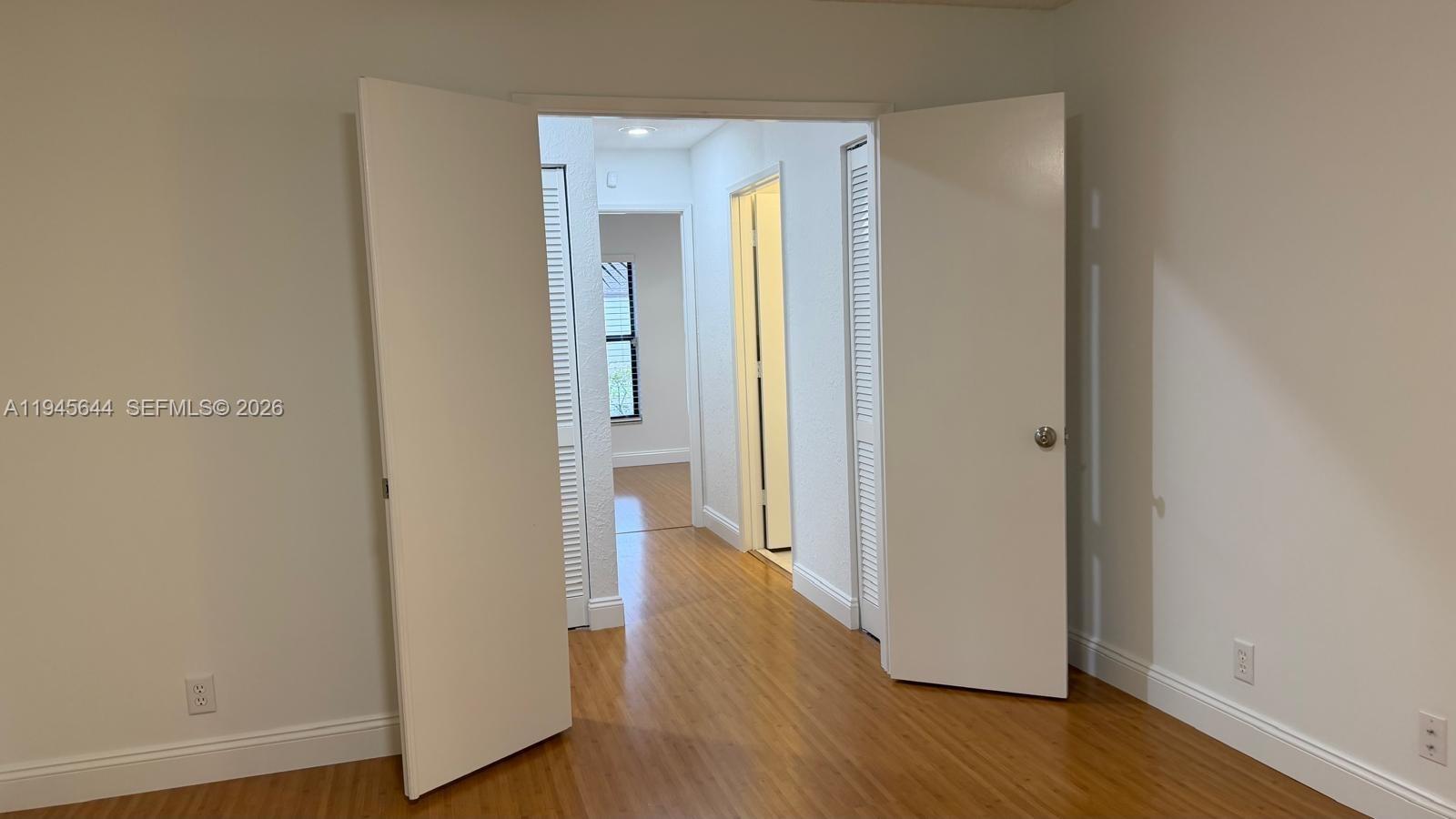 21374 Summertrace Circle Boca Raton, FL 33428 - Photo 5 of 14 a view of a hallway with wooden floor