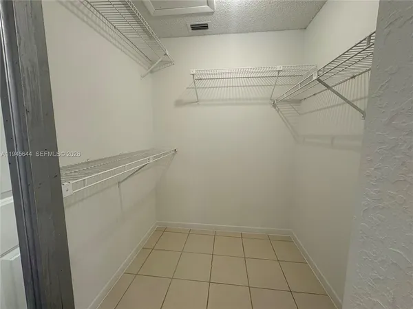a view of an empty walk in closet