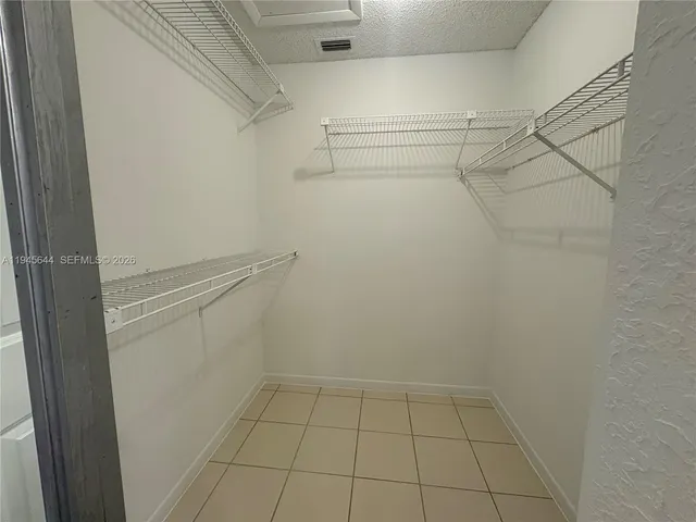 a view of an empty walk in closet