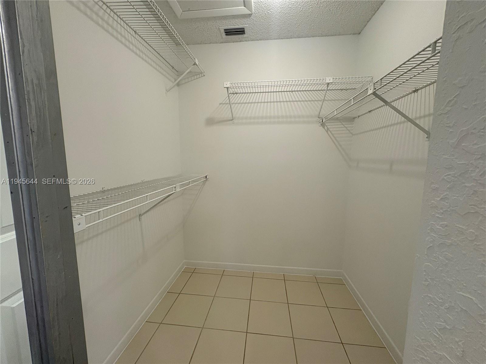 21374 Summertrace Circle Boca Raton, FL 33428 - Photo 7 of 14 a view of an empty walk in closet
