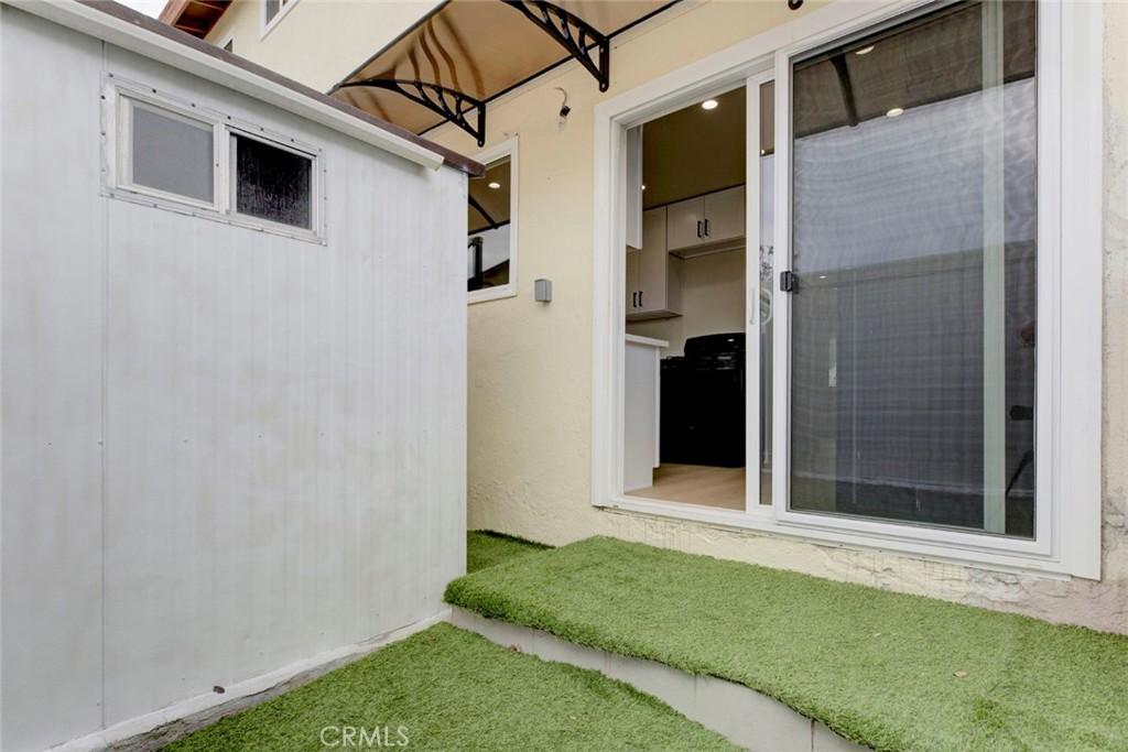 9917 Marcus Avenue, Unit 9917 Tujunga, CA 91042 - Photo 18 of 32 a view of a house with a backyard