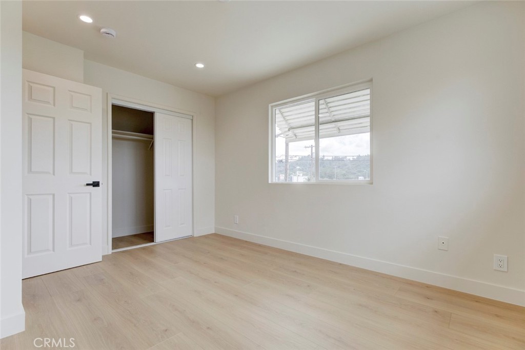 9917 Marcus Avenue, Unit 9917 Tujunga, CA 91042 - Photo 25 of 32 an empty room with windows