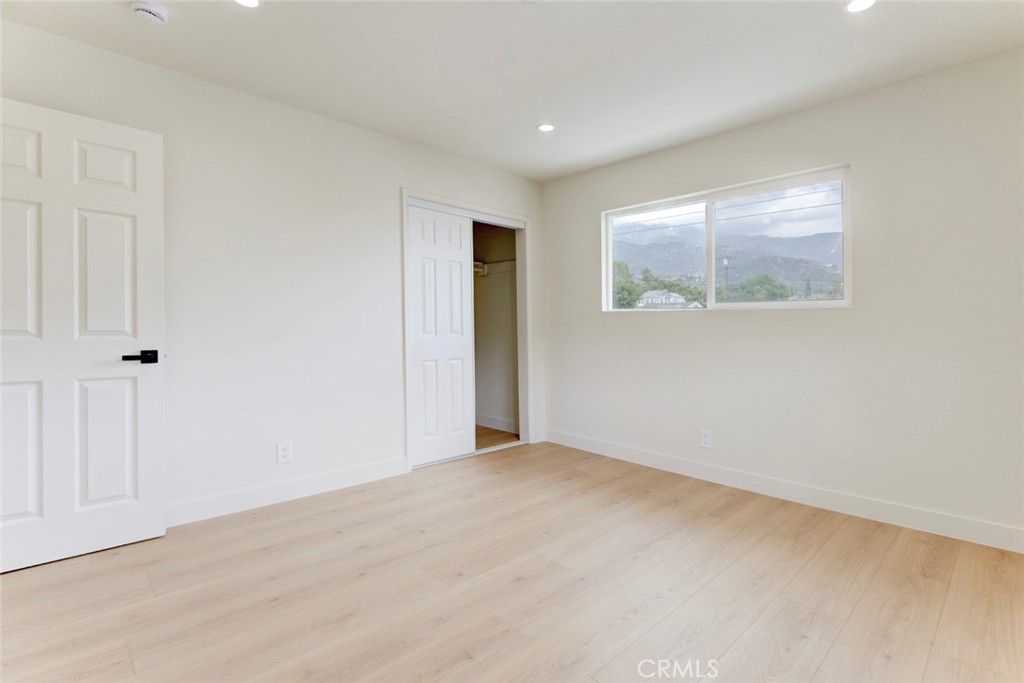 9917 Marcus Avenue, Unit 9917 Tujunga, CA 91042 - Photo 30 of 32 an empty room with a window