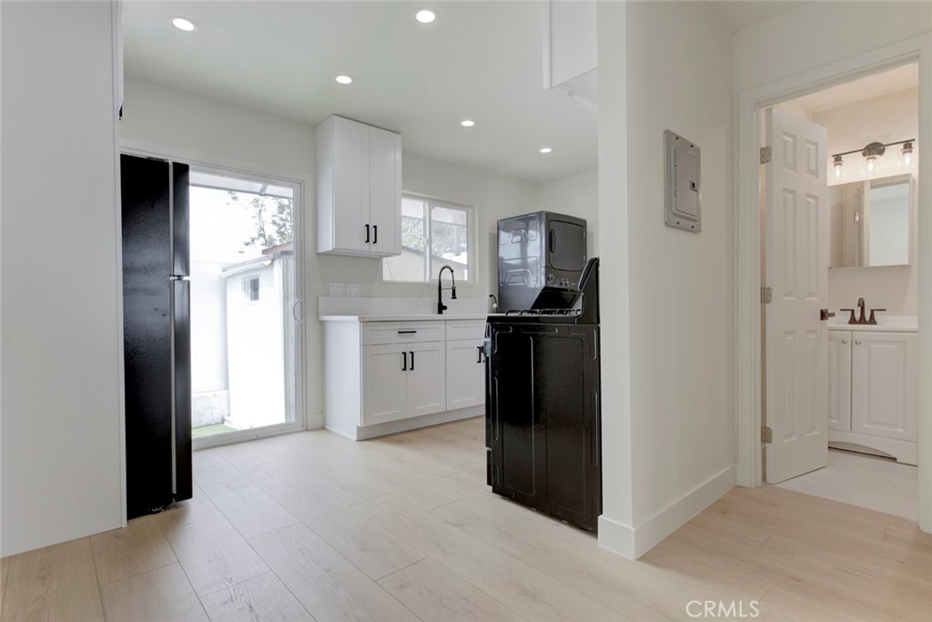 9917 Marcus Avenue, Unit 9917 Tujunga, CA 91042 - Photo 8 of 32 a kitchen with stainless steel appliances granite countertop a refrigerator and a sink