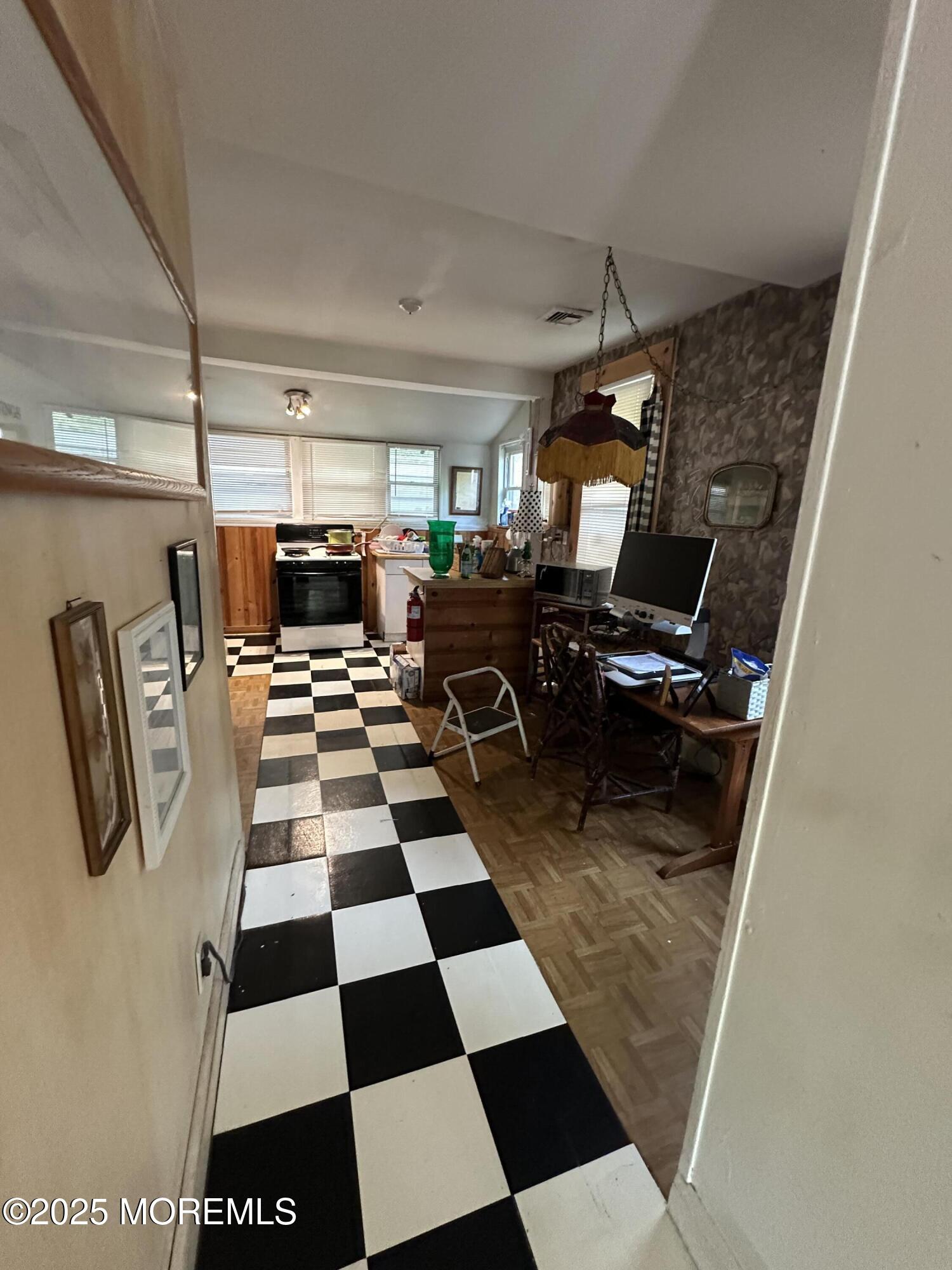 122 Hamilton Avenue Leonardo, NJ 07737 - Photo 12 of 16 a room with black and white checkered floor