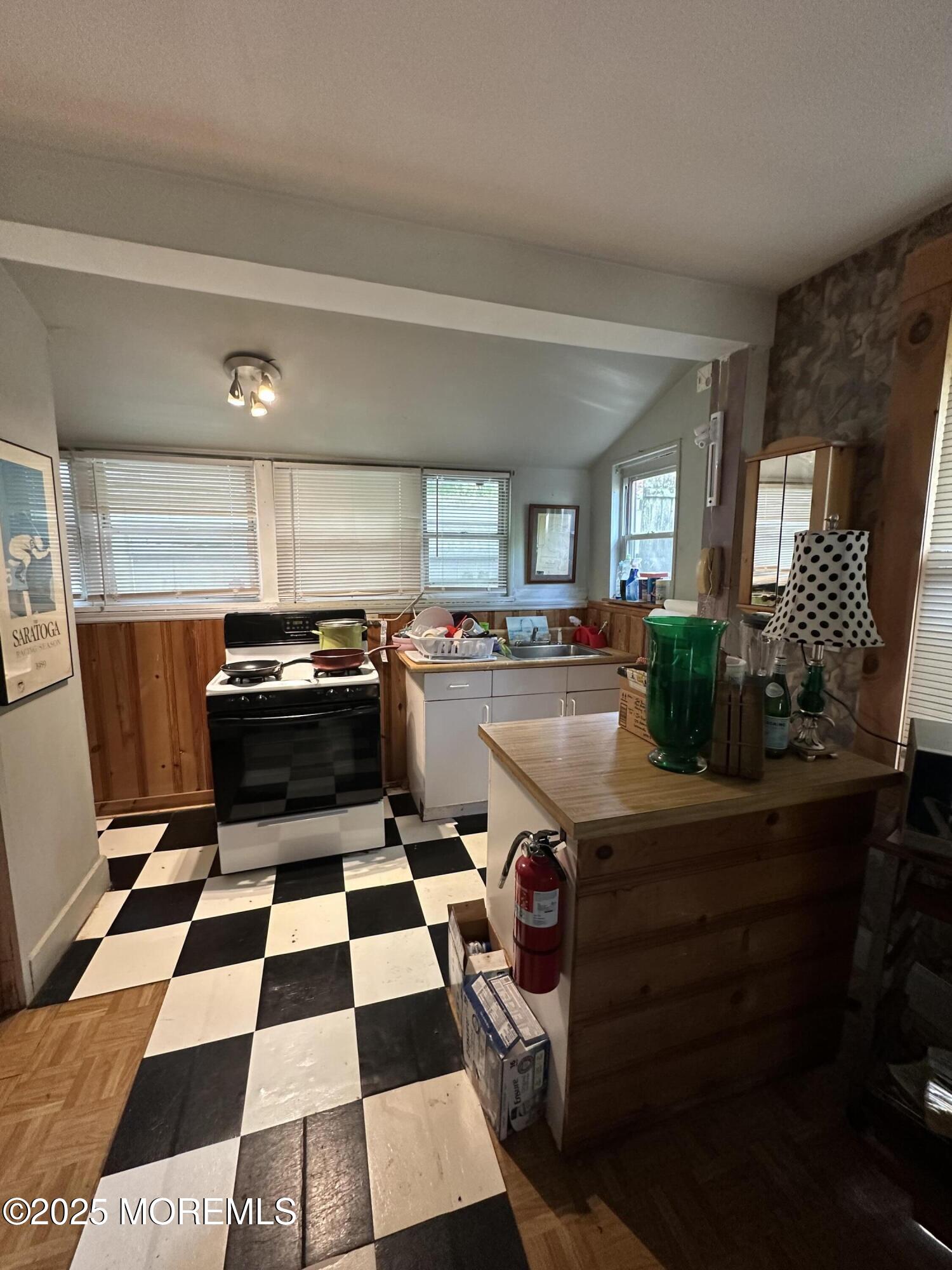 122 Hamilton Avenue Leonardo, NJ 07737 - Photo 13 of 16 a kitchen with a stove a sink and a microwave