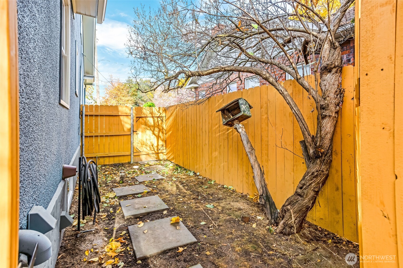 8 Newell Street Walla Walla, WA 99362 - Photo 18 of 22 a view of a yard with a tree