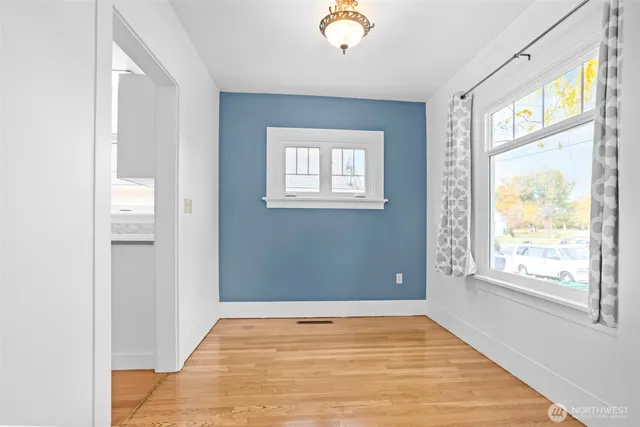 a view of an empty room with a window