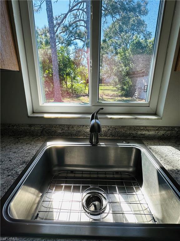 19040 Tampa Road South Fort Myers, FL 33967 - Photo 14 of 23 a stove top oven sitting inside of a kitchen