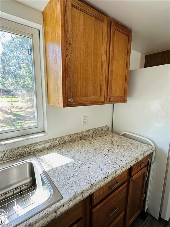 19040 Tampa Road South Fort Myers, FL 33967 - Photo 15 of 23 a kitchen with granite countertop a sink and a window