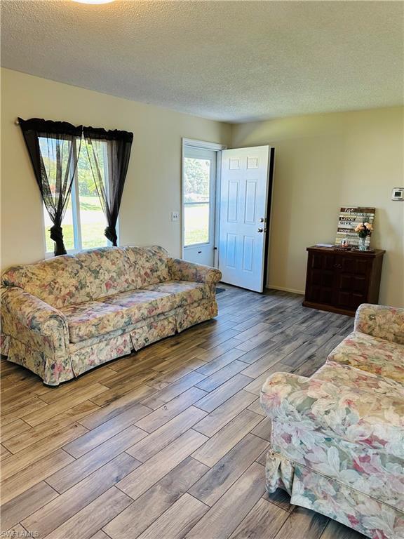 19040 Tampa Road South Fort Myers, FL 33967 - Photo 7 of 23 a bedroom with a bed and a dresser